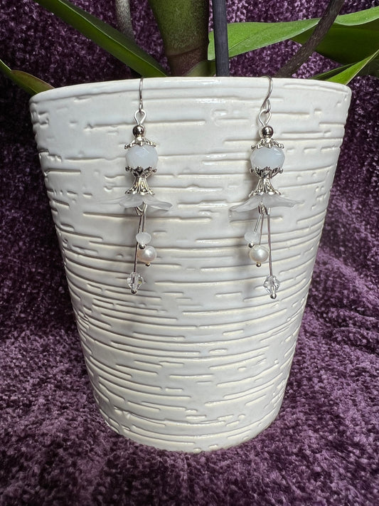 Earrings- Silver plated metal with fresh water pearls, crystals, and white acrylic flowers.