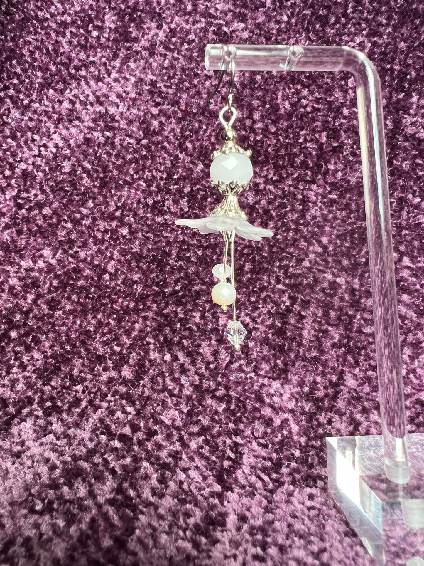 Earrings- Silver plated metal with fresh water pearls, crystals, and white acrylic flowers.