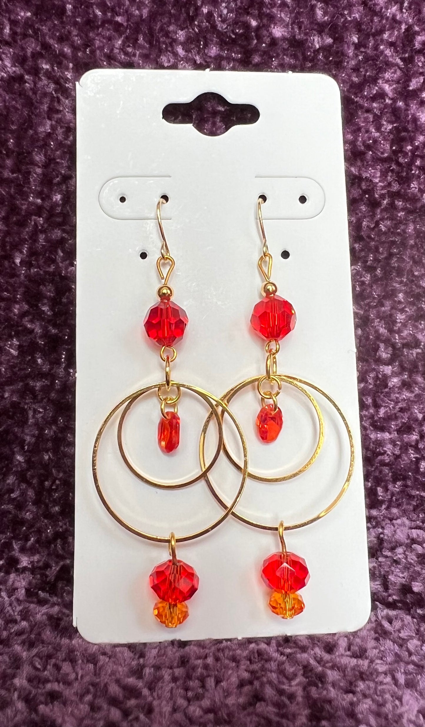 Earrings- Gold plated metal with orange & red crystal & cubic zirconia beads.