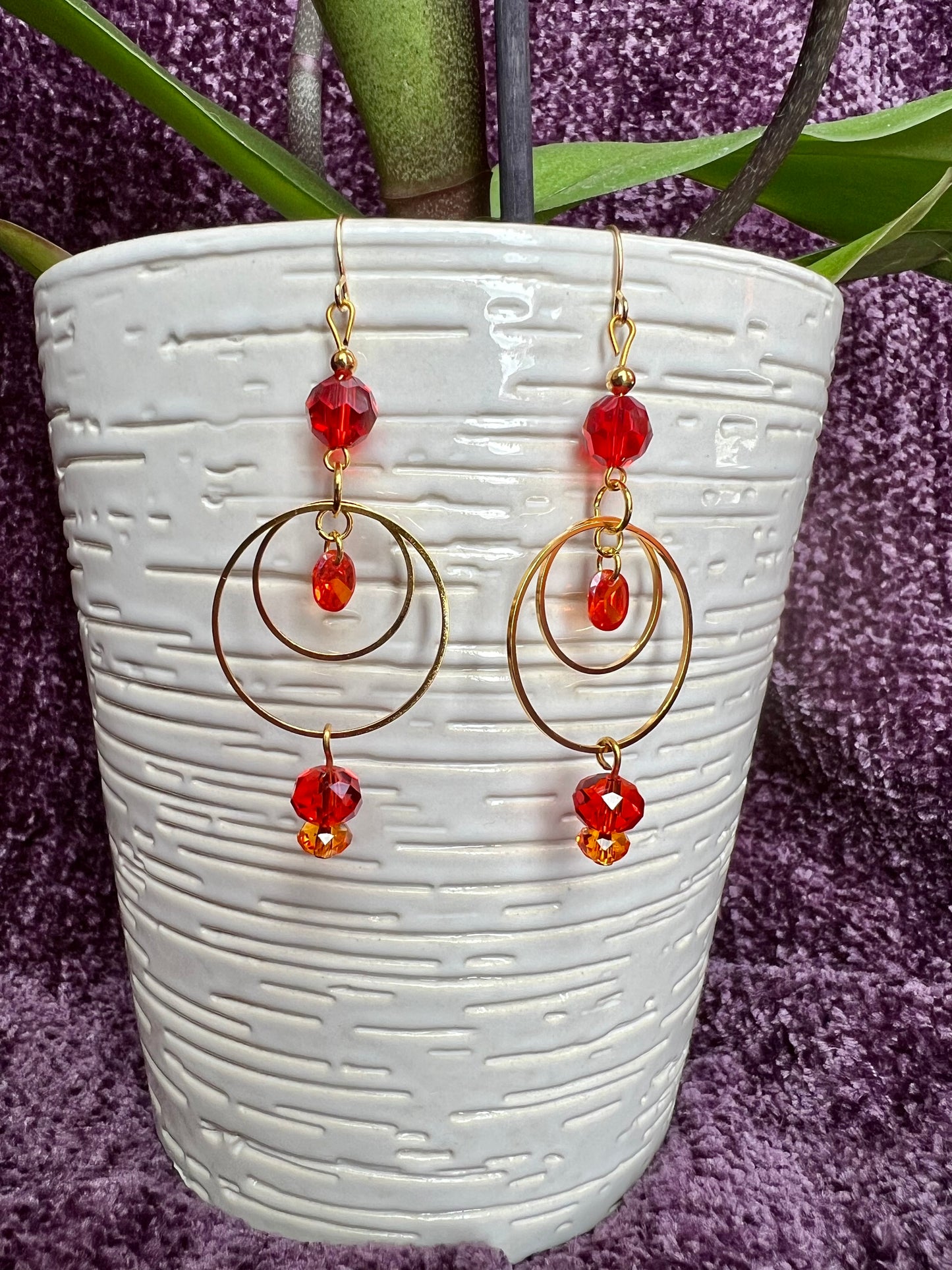 Earrings- Gold plated metal with orange & red crystal & cubic zirconia beads.