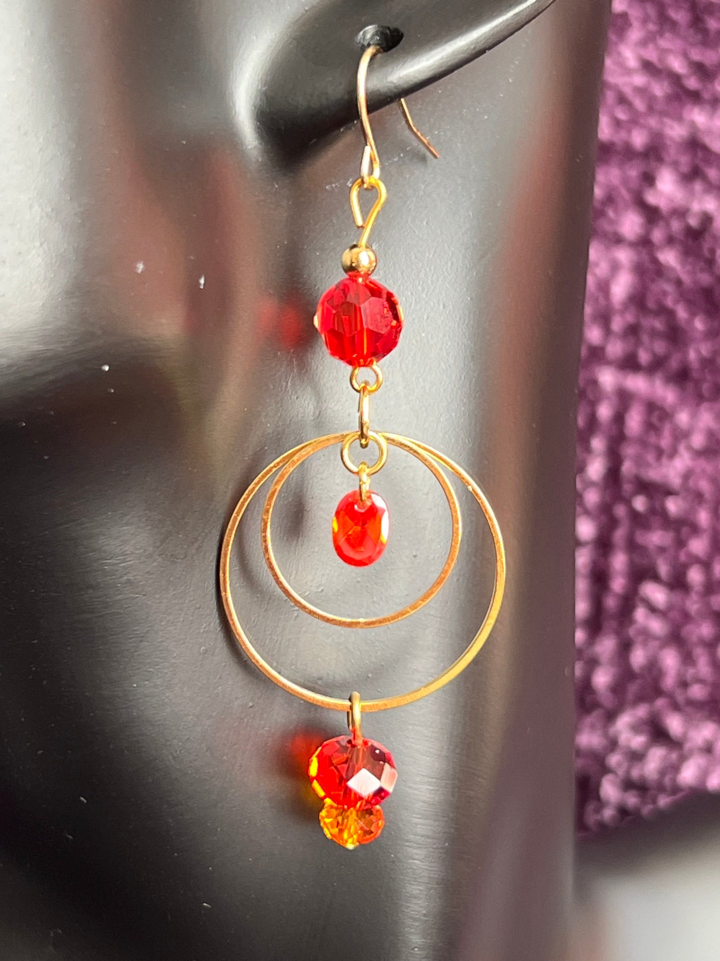 Earrings- Gold plated metal with orange & red crystal & cubic zirconia beads.