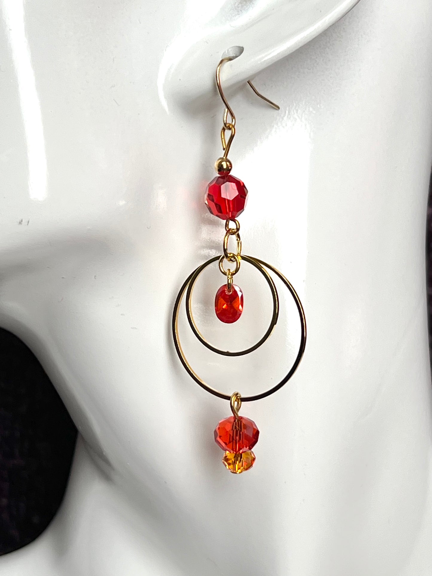 Earrings- Gold plated metal with orange & red crystal & cubic zirconia beads.