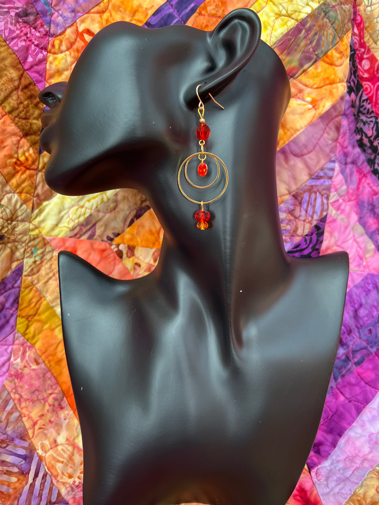 Earrings- Gold plated metal with orange & red crystal & cubic zirconia beads.