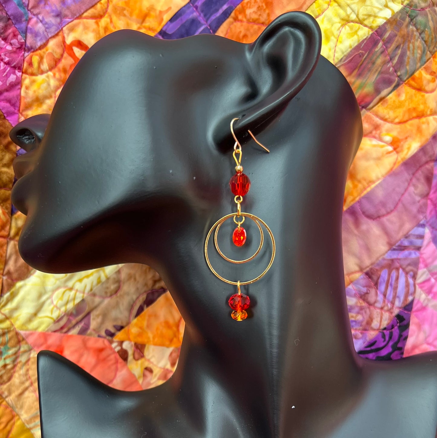 Earrings- Gold plated metal with orange & red crystal & cubic zirconia beads.