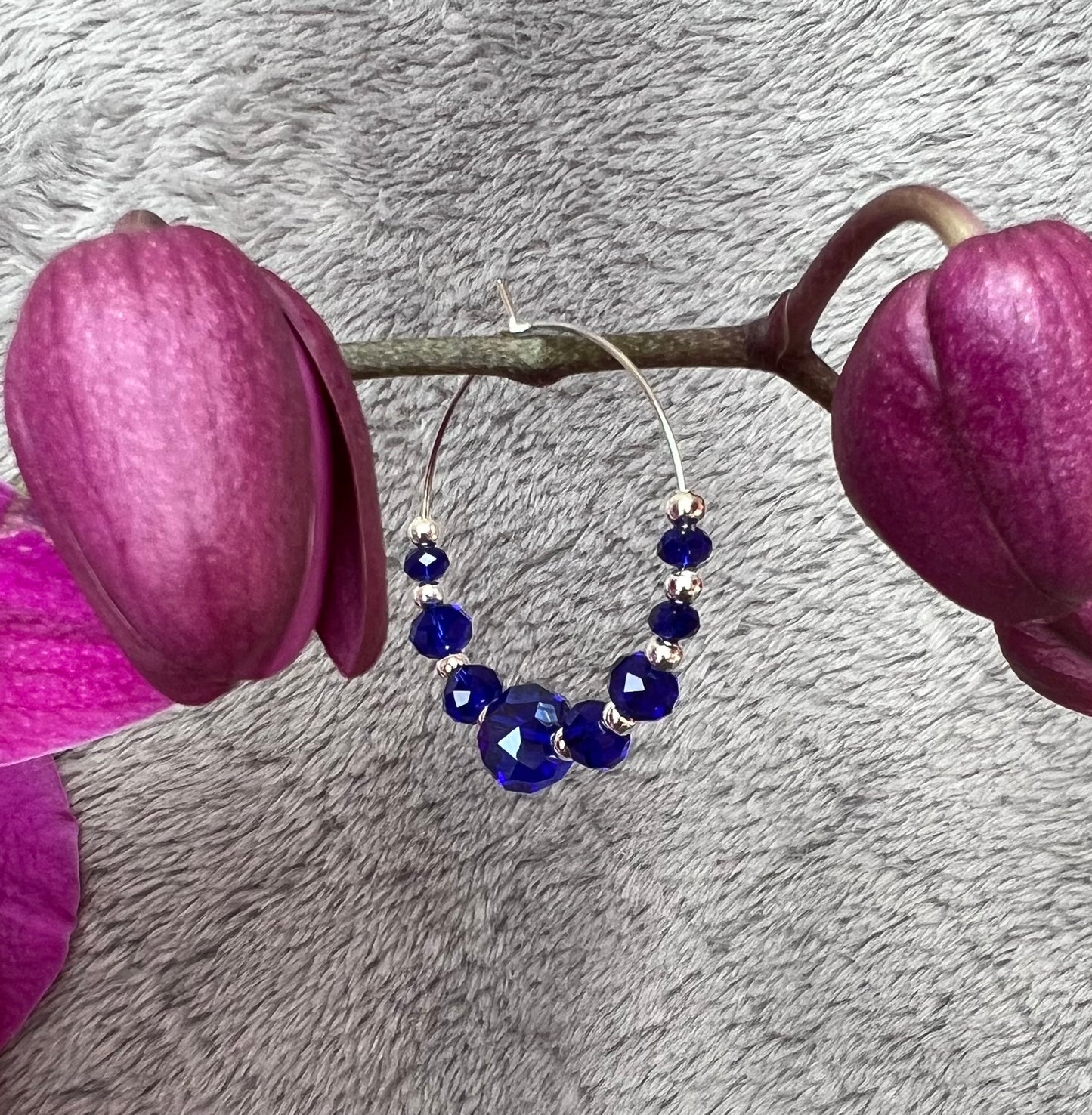 Earrings- Silver plated metal with cobalt blue crystal beads.