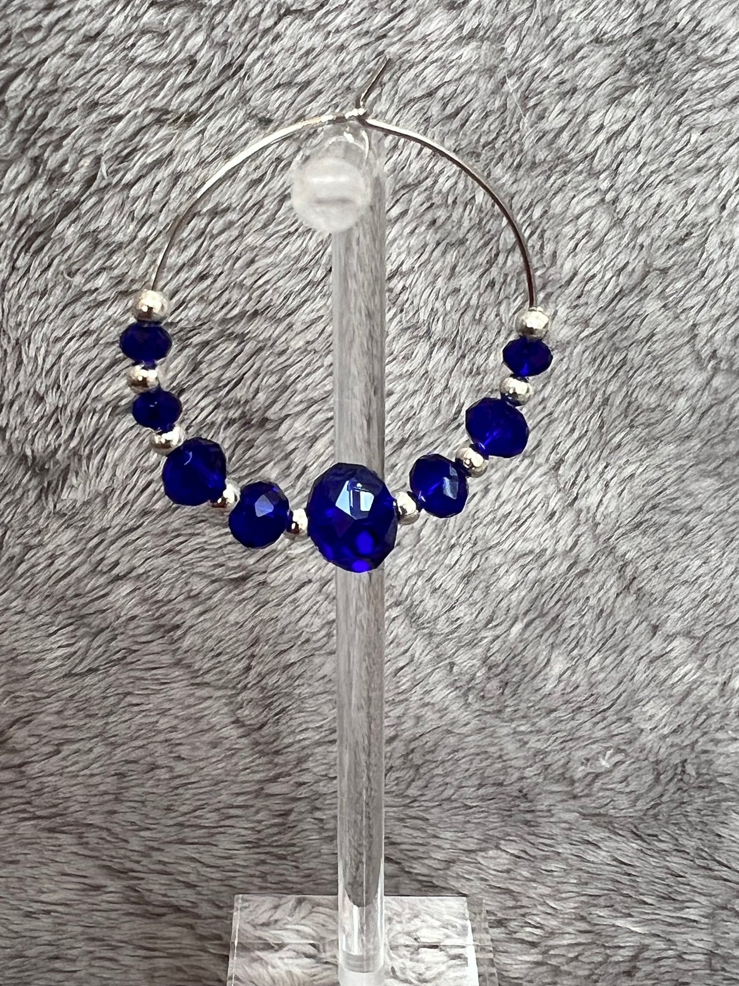 Earrings- Silver plated metal with cobalt blue crystal beads.