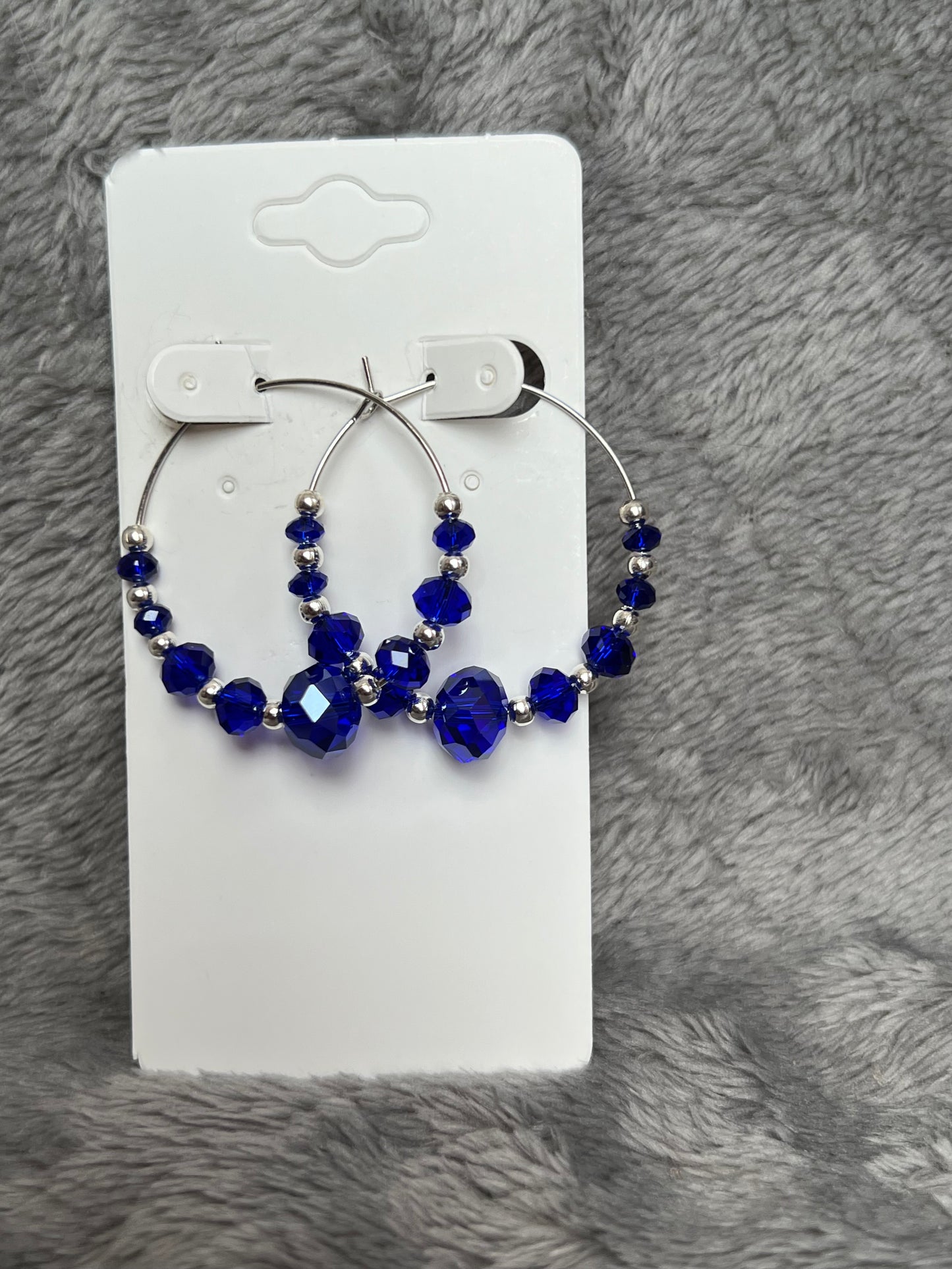 Earrings- Silver plated metal with cobalt blue crystal beads.