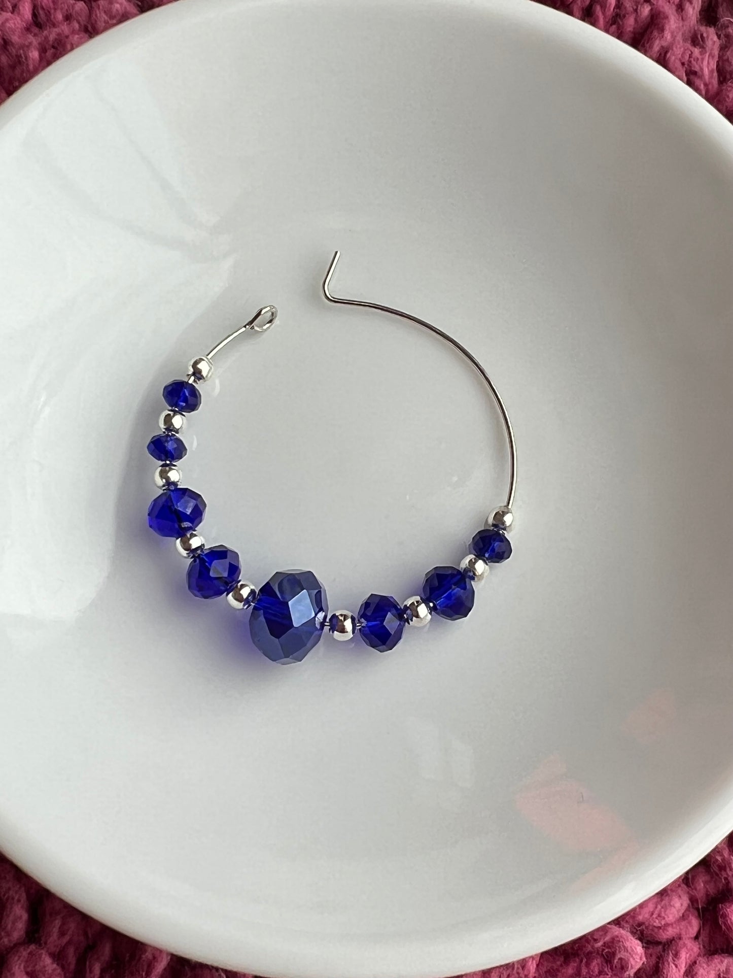 Earrings- Silver plated metal with cobalt blue crystal beads.