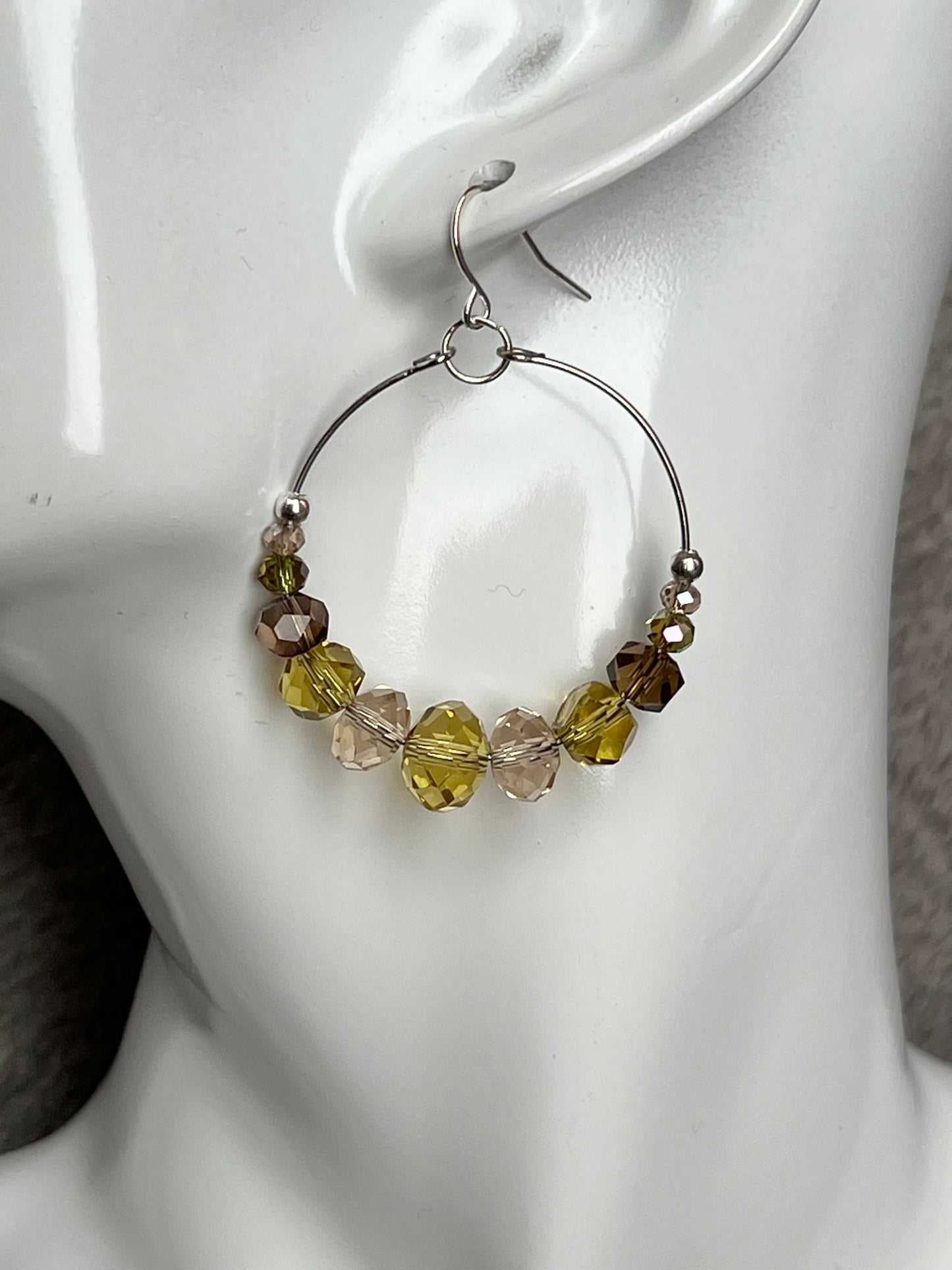 Earrings- Silver plated metal with cream, smoky quartz, & olive green crystal beads.