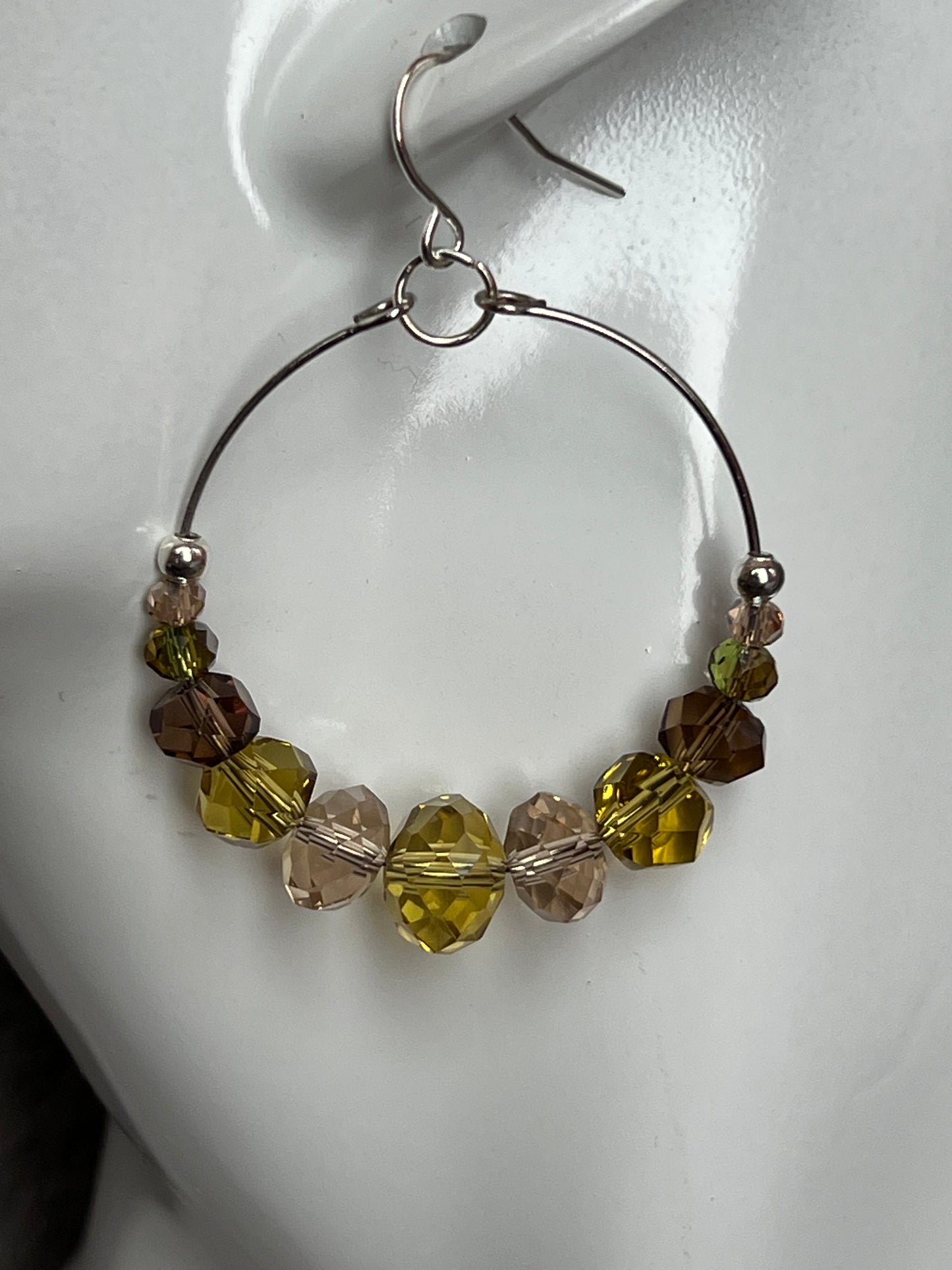 Earrings- Silver plated metal with cream, smoky quartz, & olive green crystal beads.