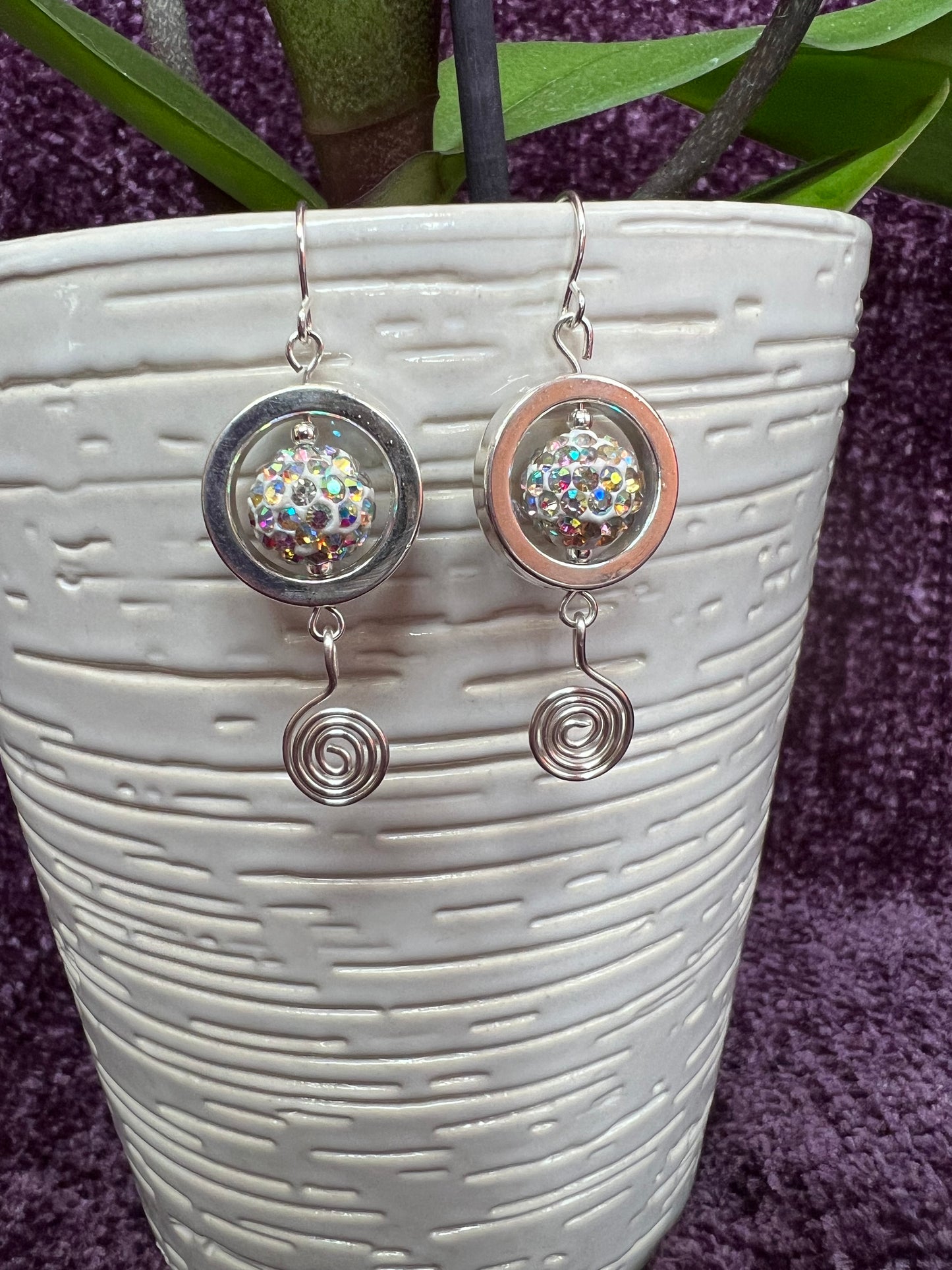 Earrings- Silver plated metal with AB crystals and swirl bead.