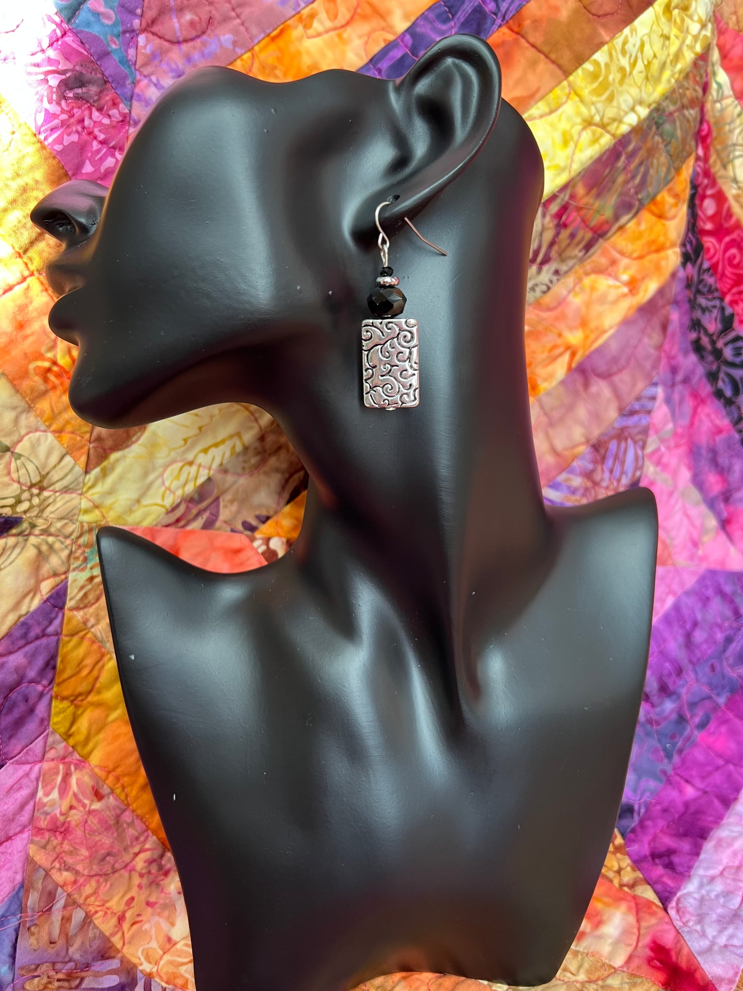 Earrings- Silver plated metal with black crystals beads.