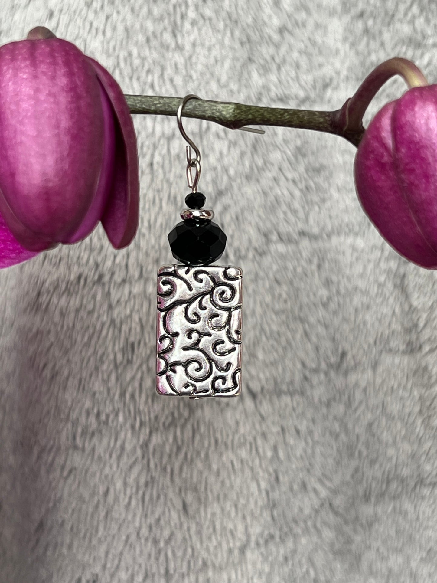 Earrings- Silver plated metal with black crystals beads.