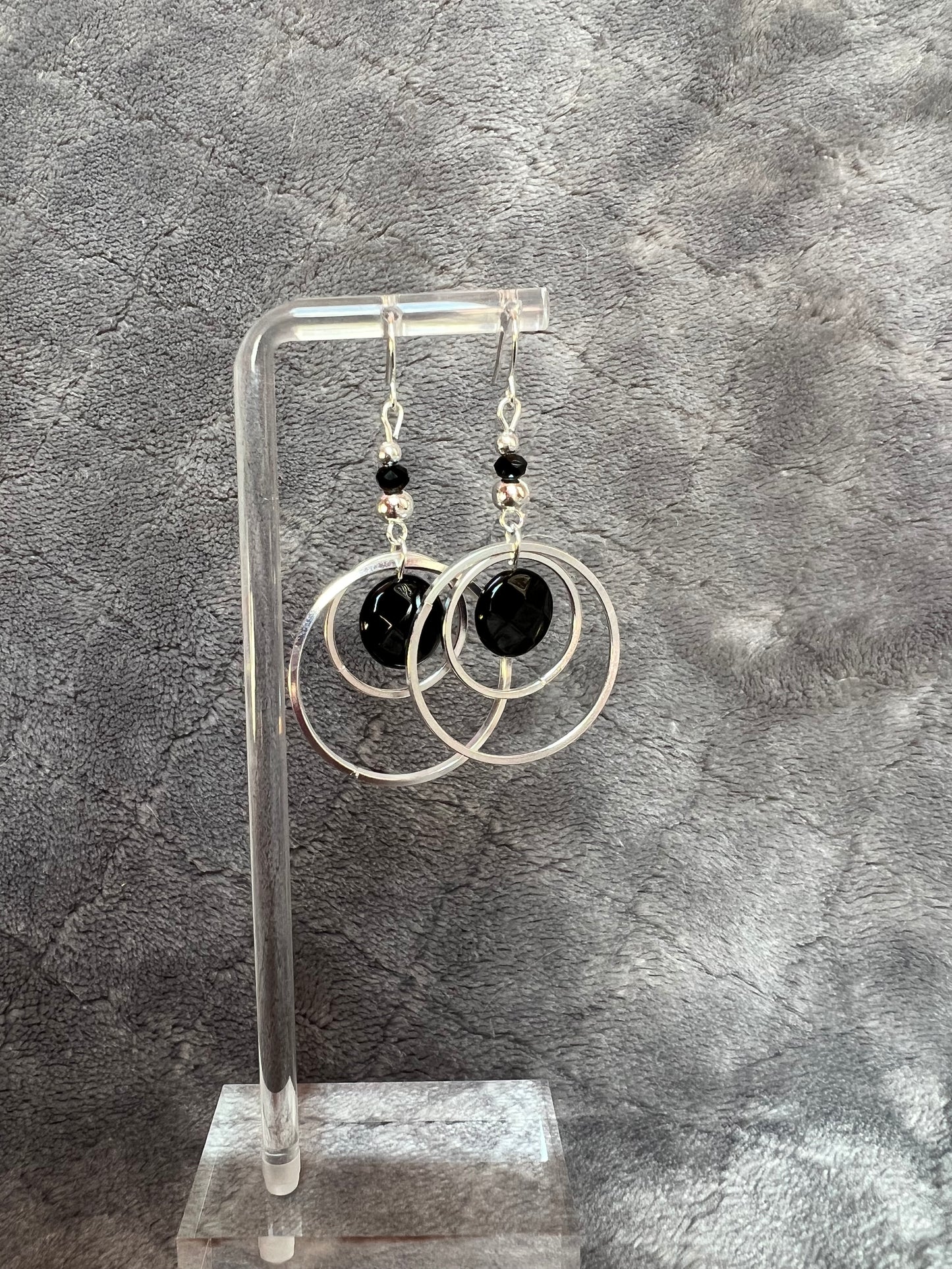 Earrings- Silver plated metal hoops with onyx coin beads.