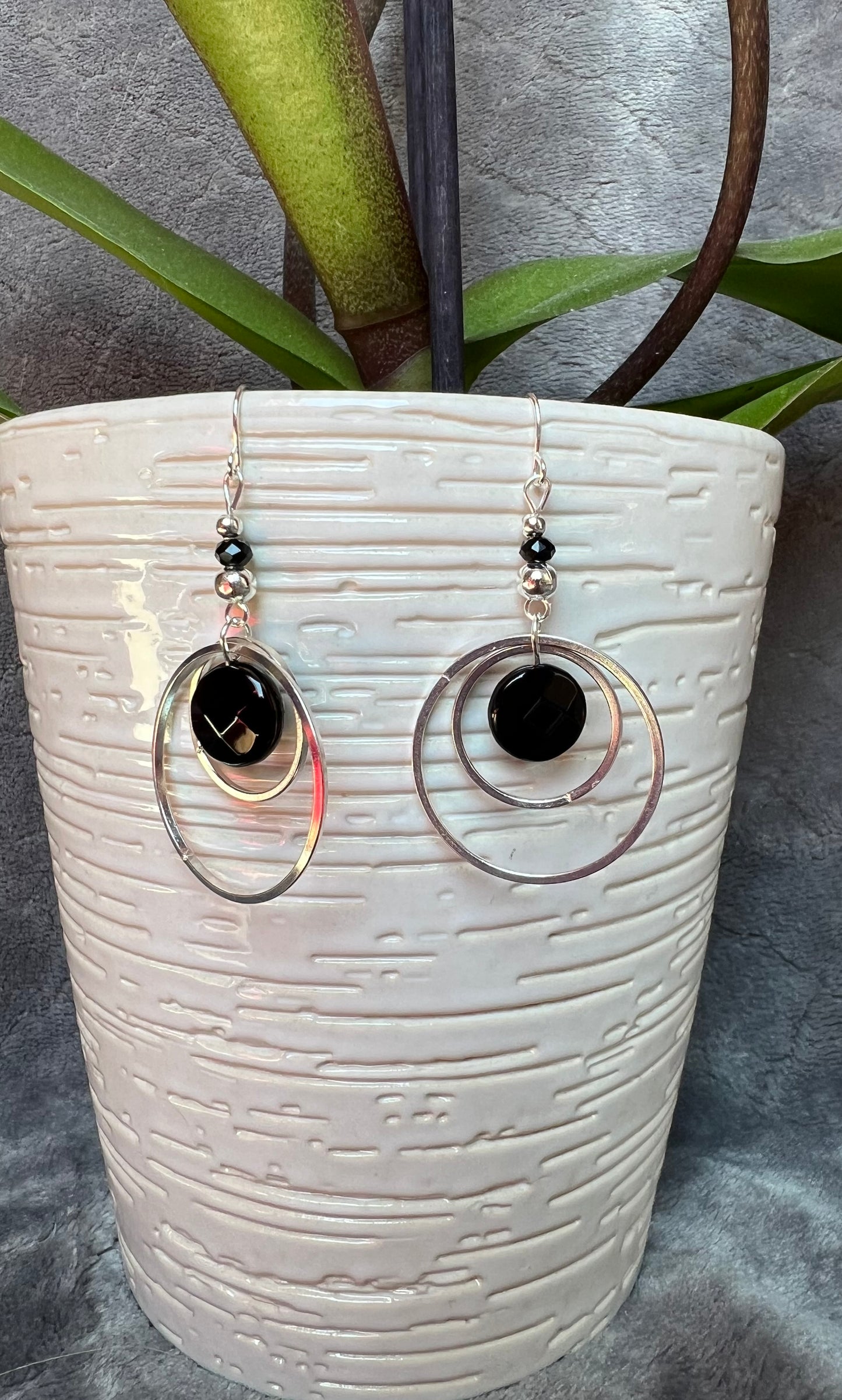 Earrings- Silver plated metal hoops with onyx coin beads.