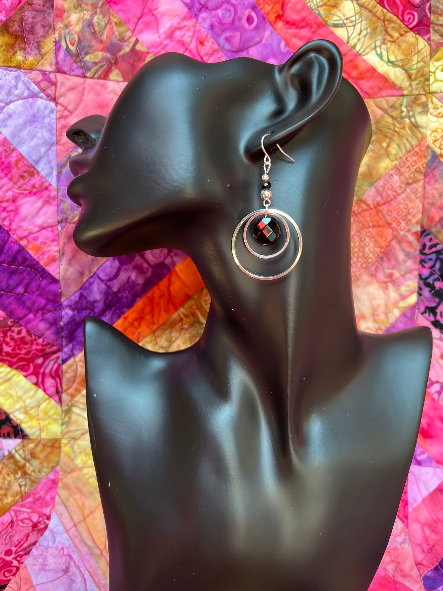 Earrings- Silver plated metal hoops with onyx coin beads.