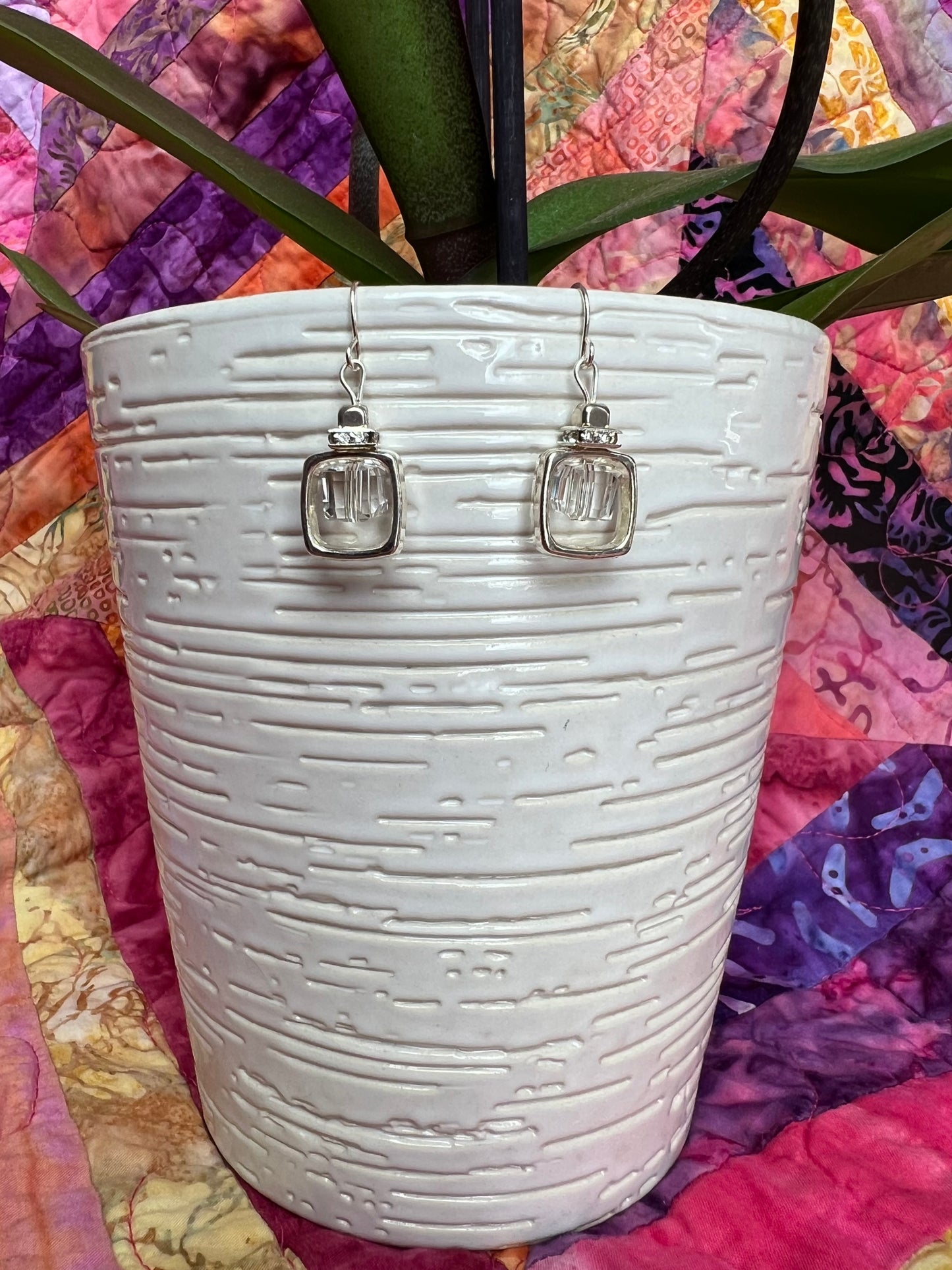 Earrings- Silver plated metal with clear crystal square rondelle and square crystal bead in center.