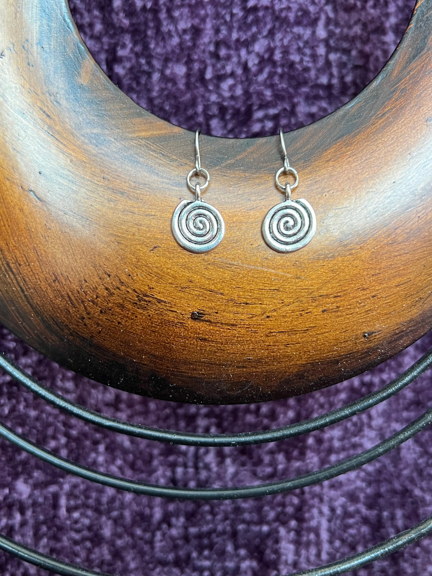 Earrings- Silver plated metal swirls.