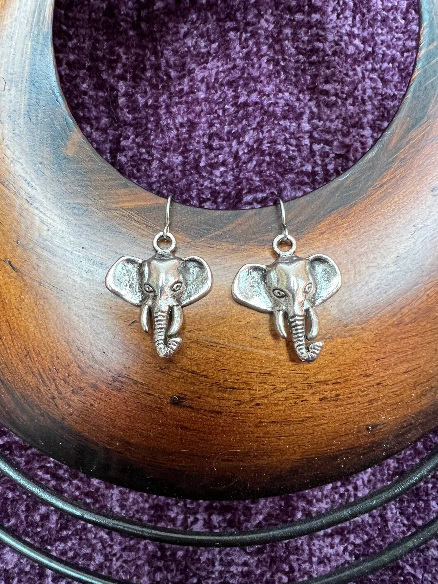 Earrings- Silver plated metal elephants.