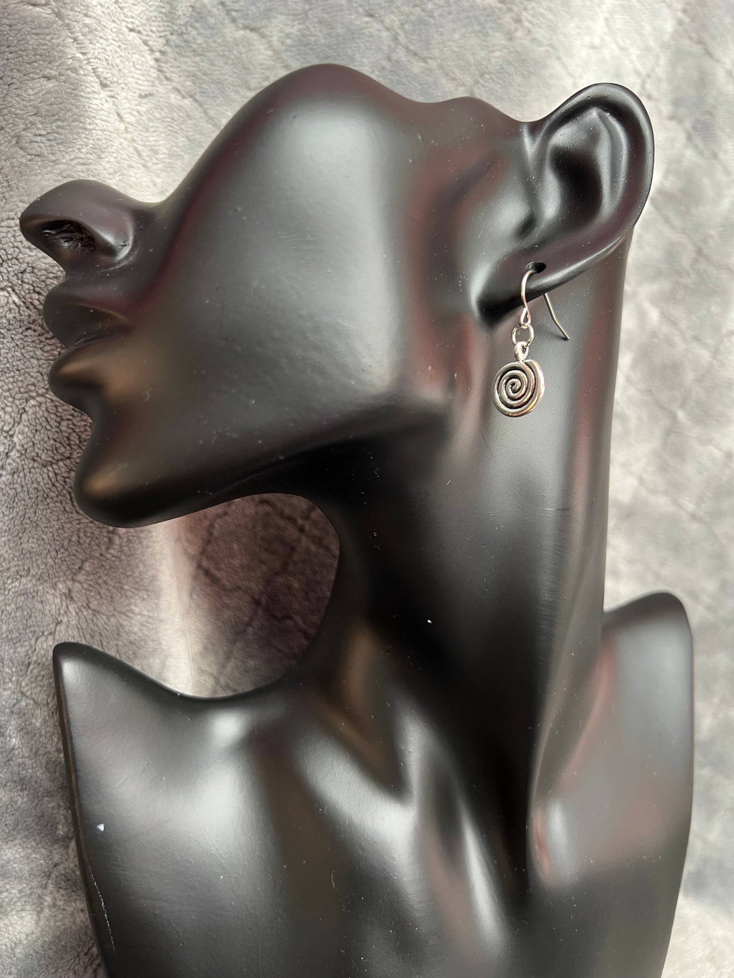 Earrings- Silver plated metal swirls.