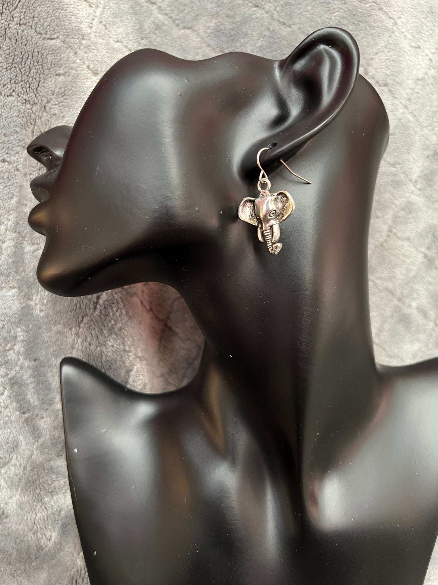 Earrings- Silver plated metal elephants.