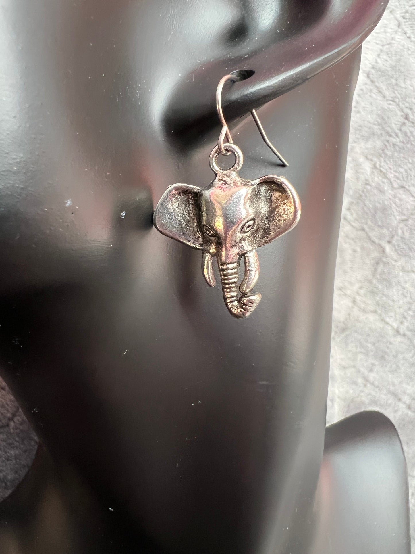 Earrings- Silver plated metal elephants.