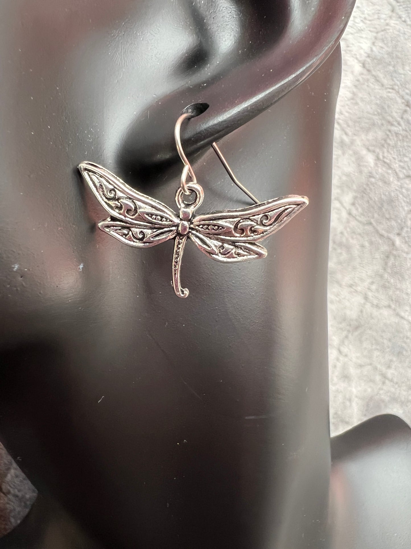 Earrings- Silver plated metal dragon flies.