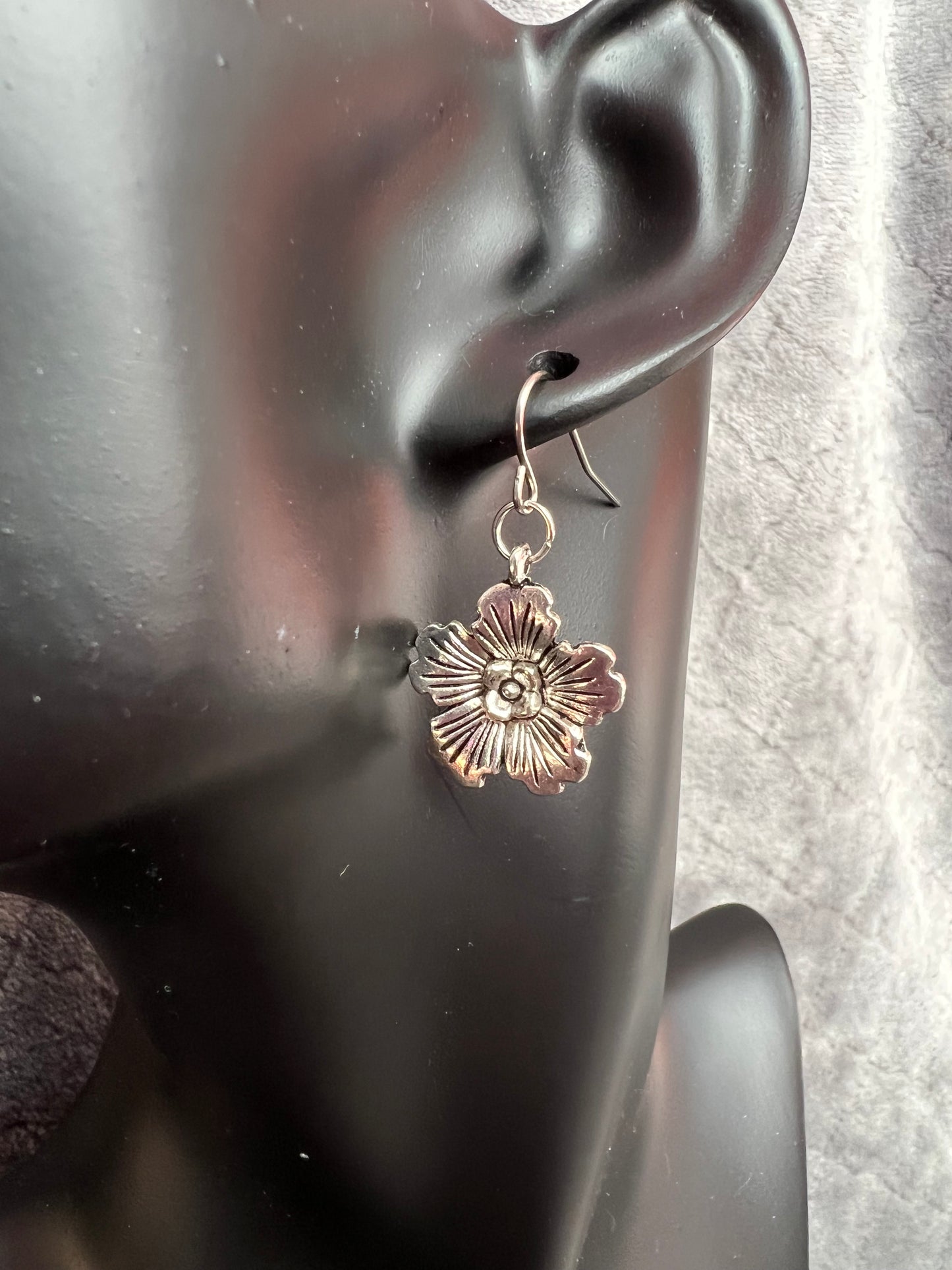 Earrings- Silver plated metal hibiscus flowers.