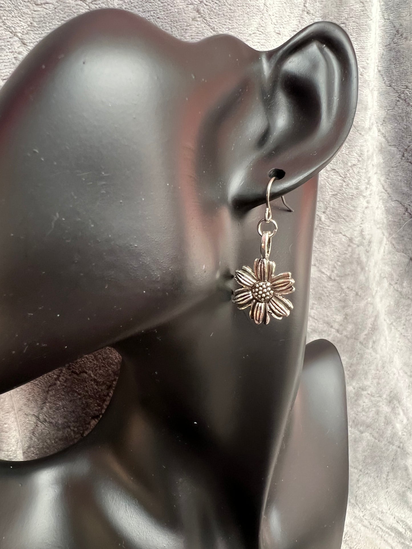 Earrings- Silver plated metal sunflowers.