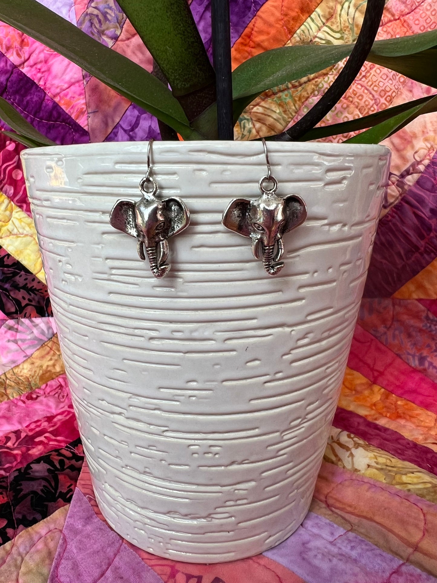 Earrings- Silver plated metal elephants.