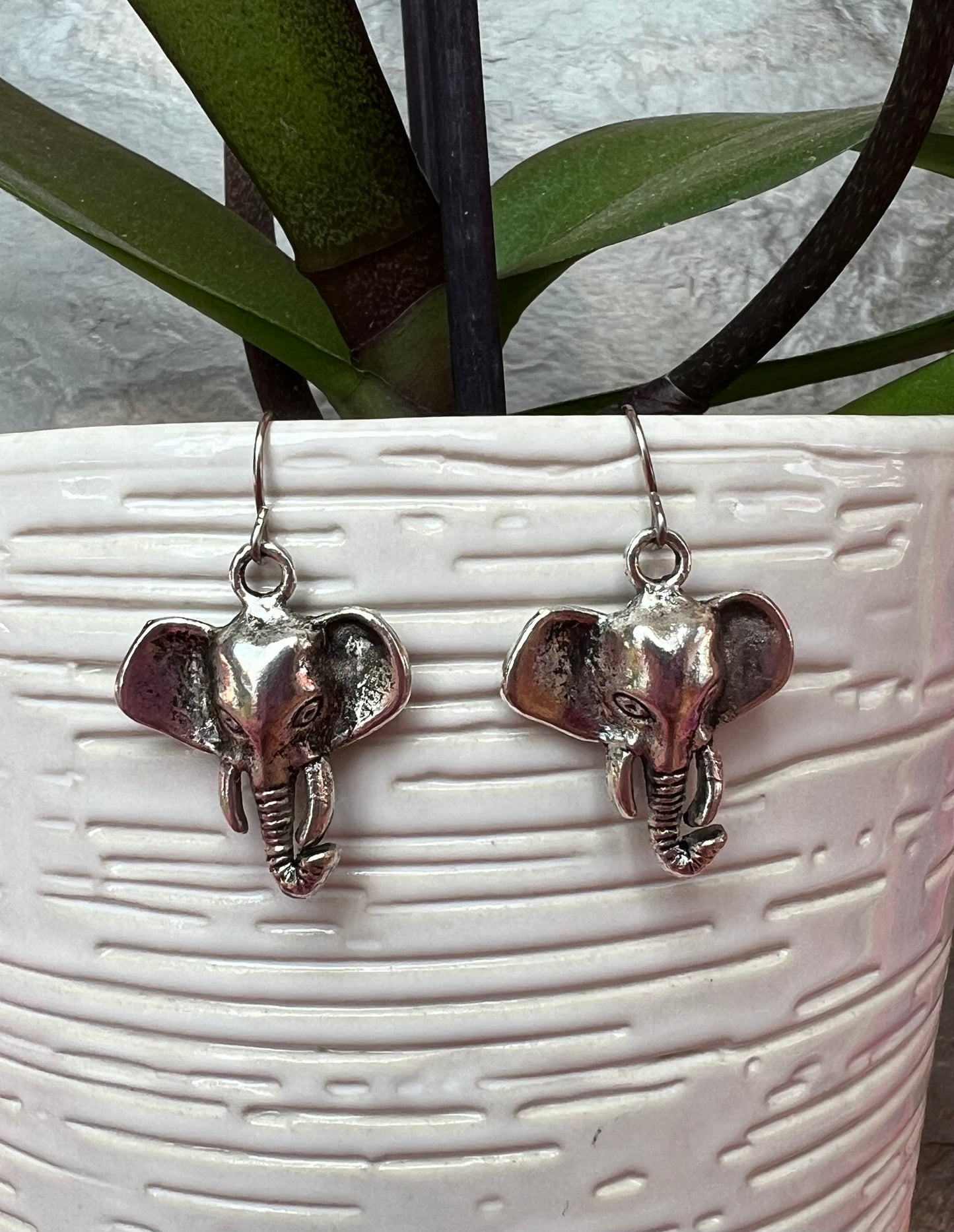 Earrings- Silver plated metal elephants.