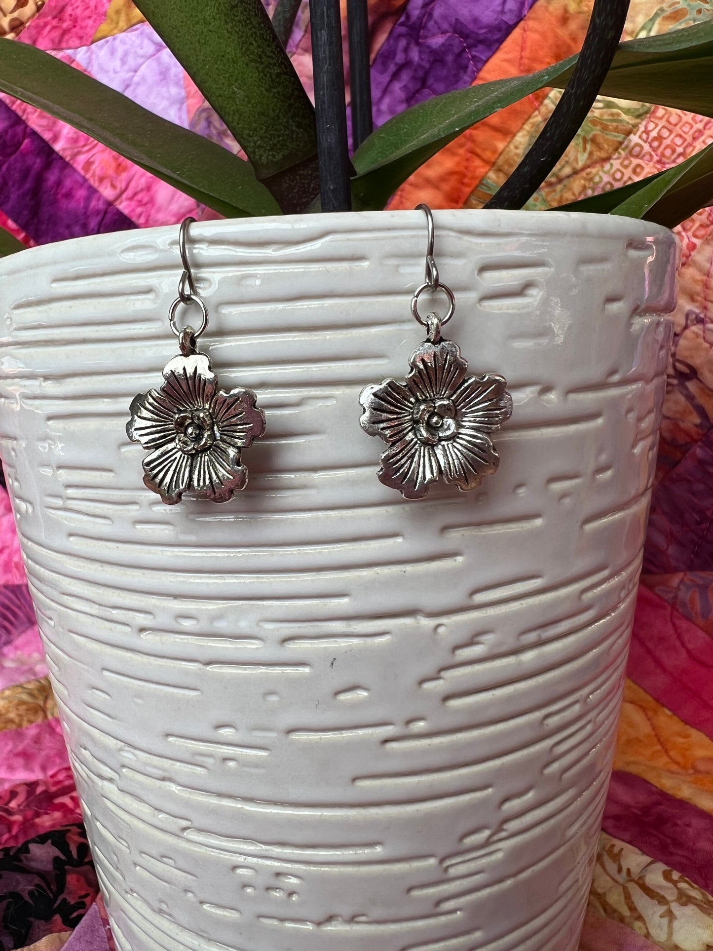 Earrings- Silver plated metal hibiscus flowers.