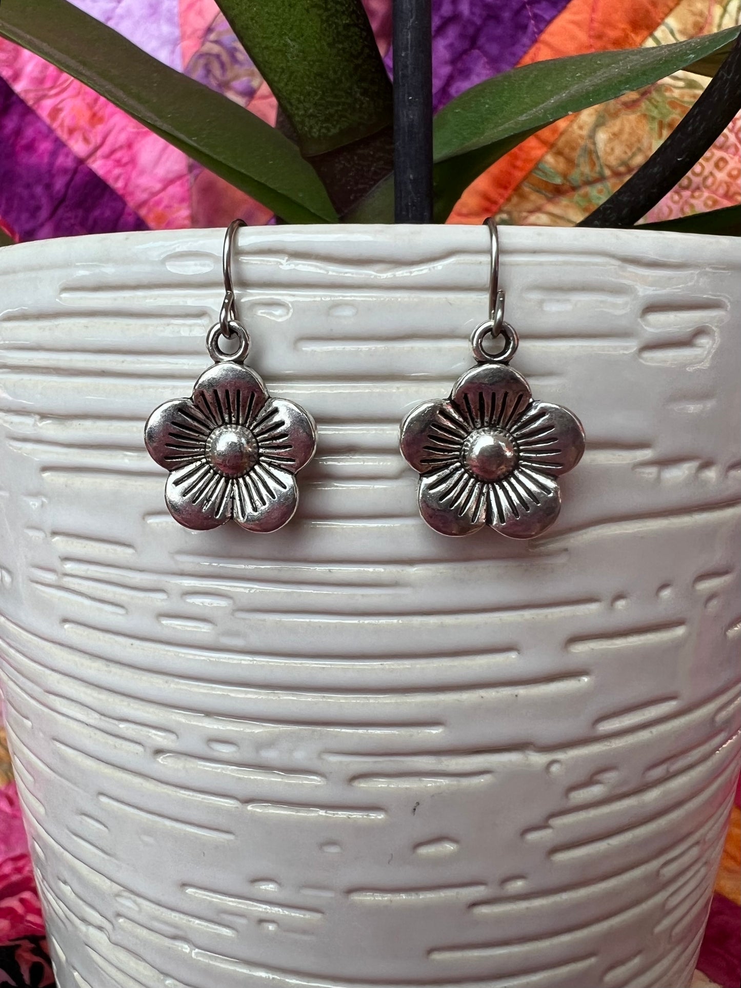 Earrings- Silver plated metal flowers.