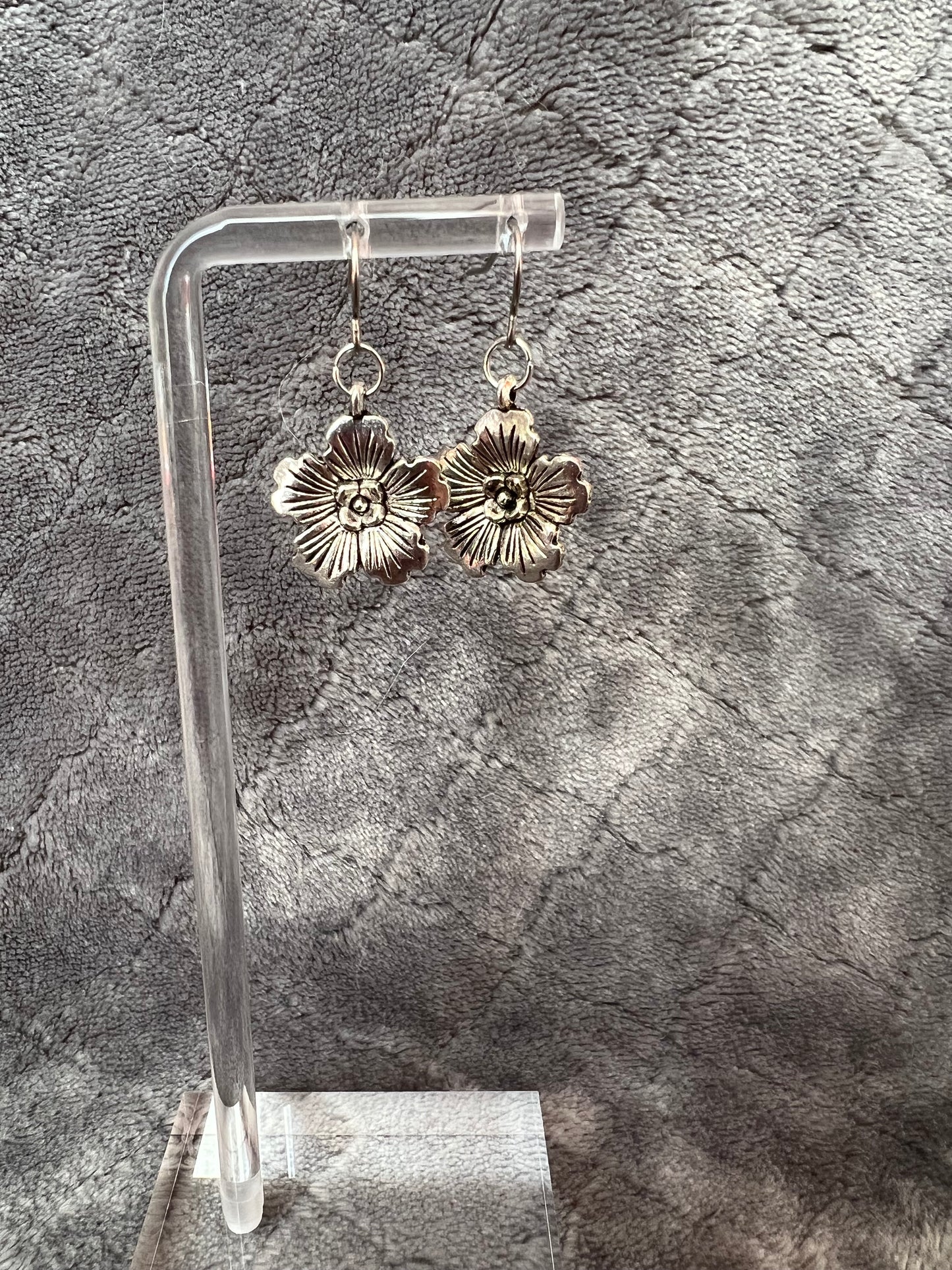 Earrings- Silver plated metal hibiscus flowers.