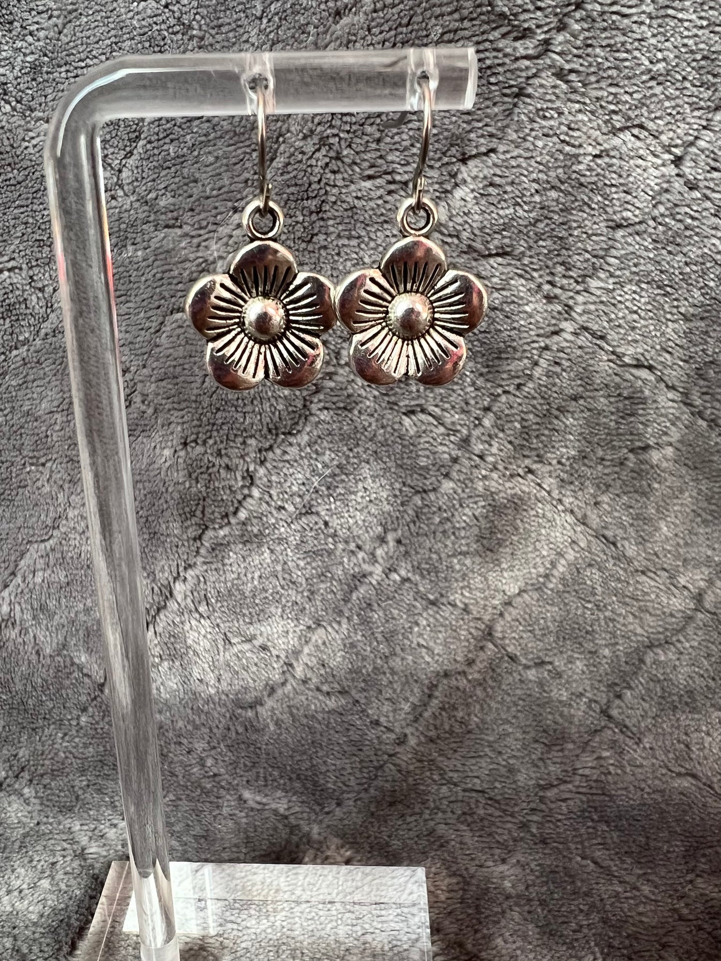 Earrings- Silver plated metal flowers.