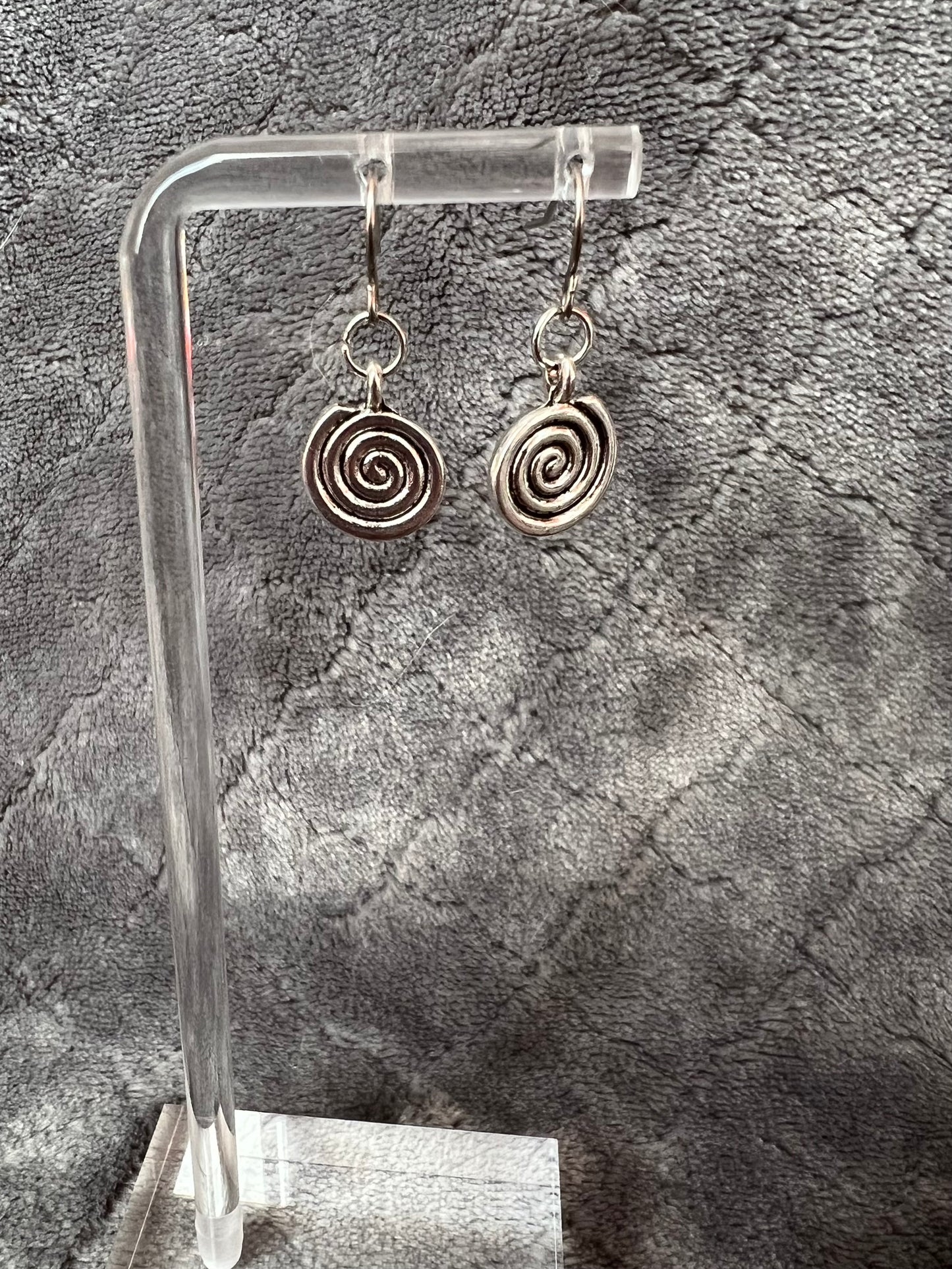 Earrings- Silver plated metal swirls.