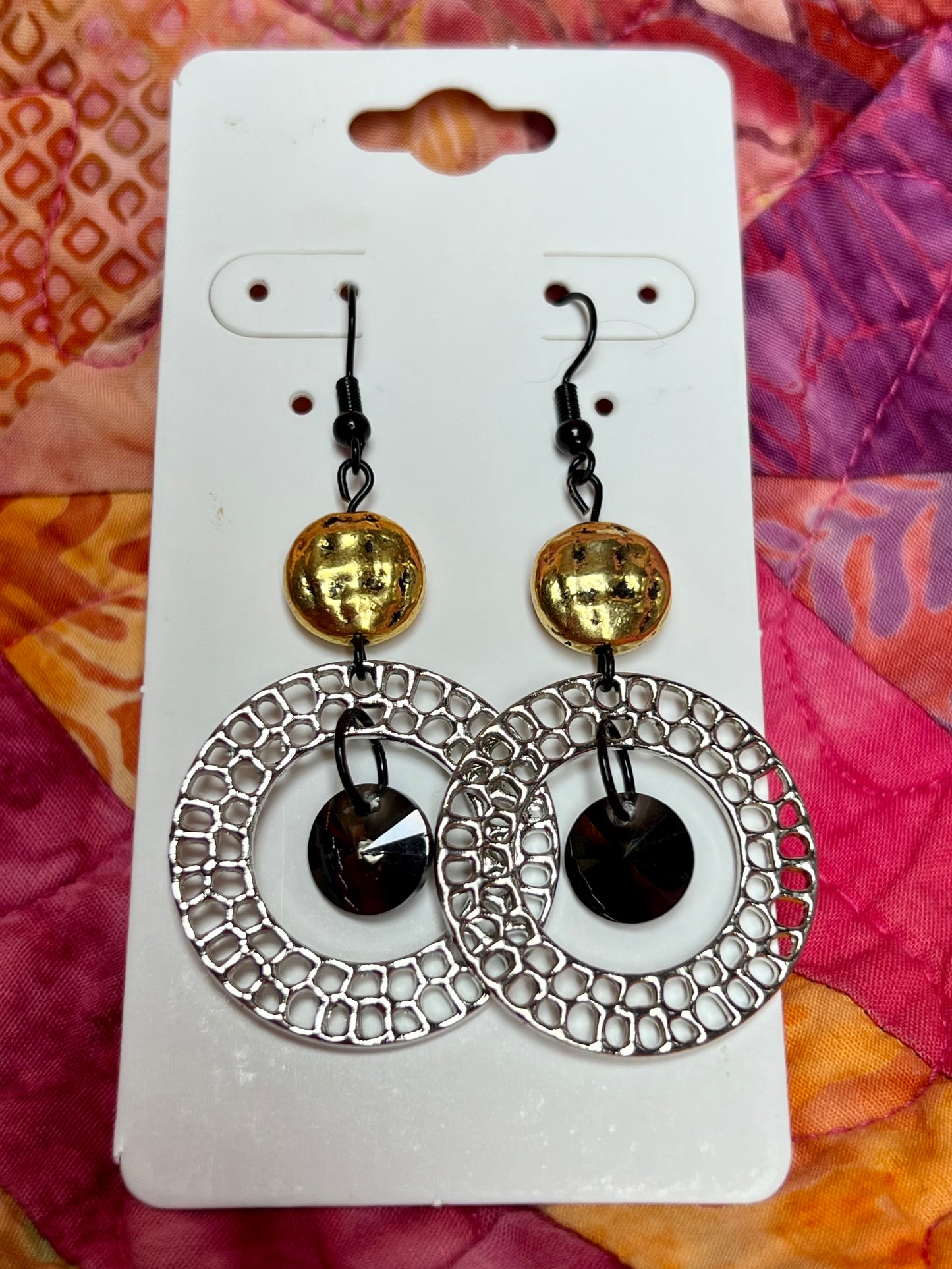 Earrings- Black plated wires, gun metal hoops, antiqued gold plated beads, & black crystals.