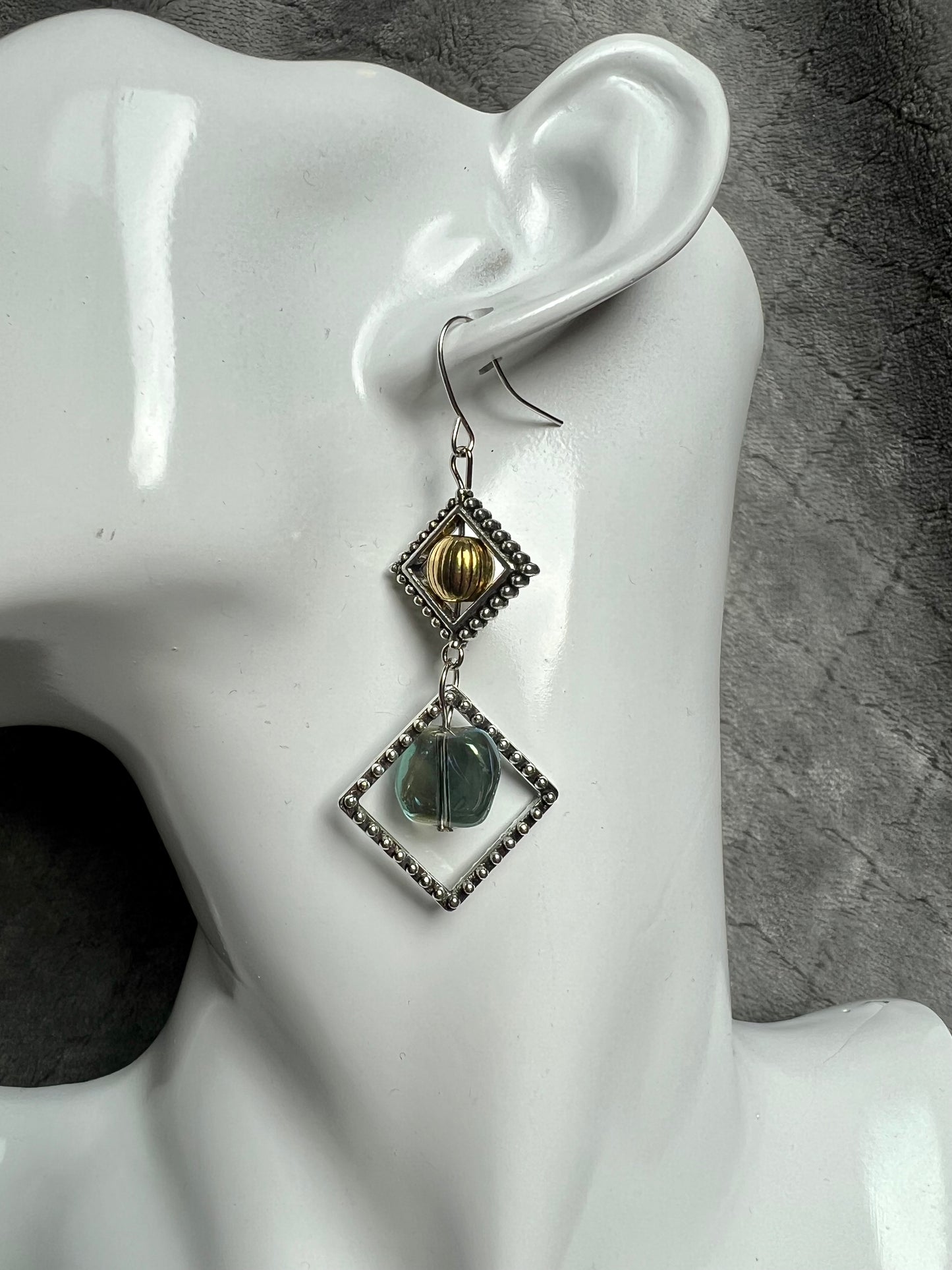 Earrings- Silver plated hooks with antique silver plated metal, round bead, and blue/green glass bead dangle.