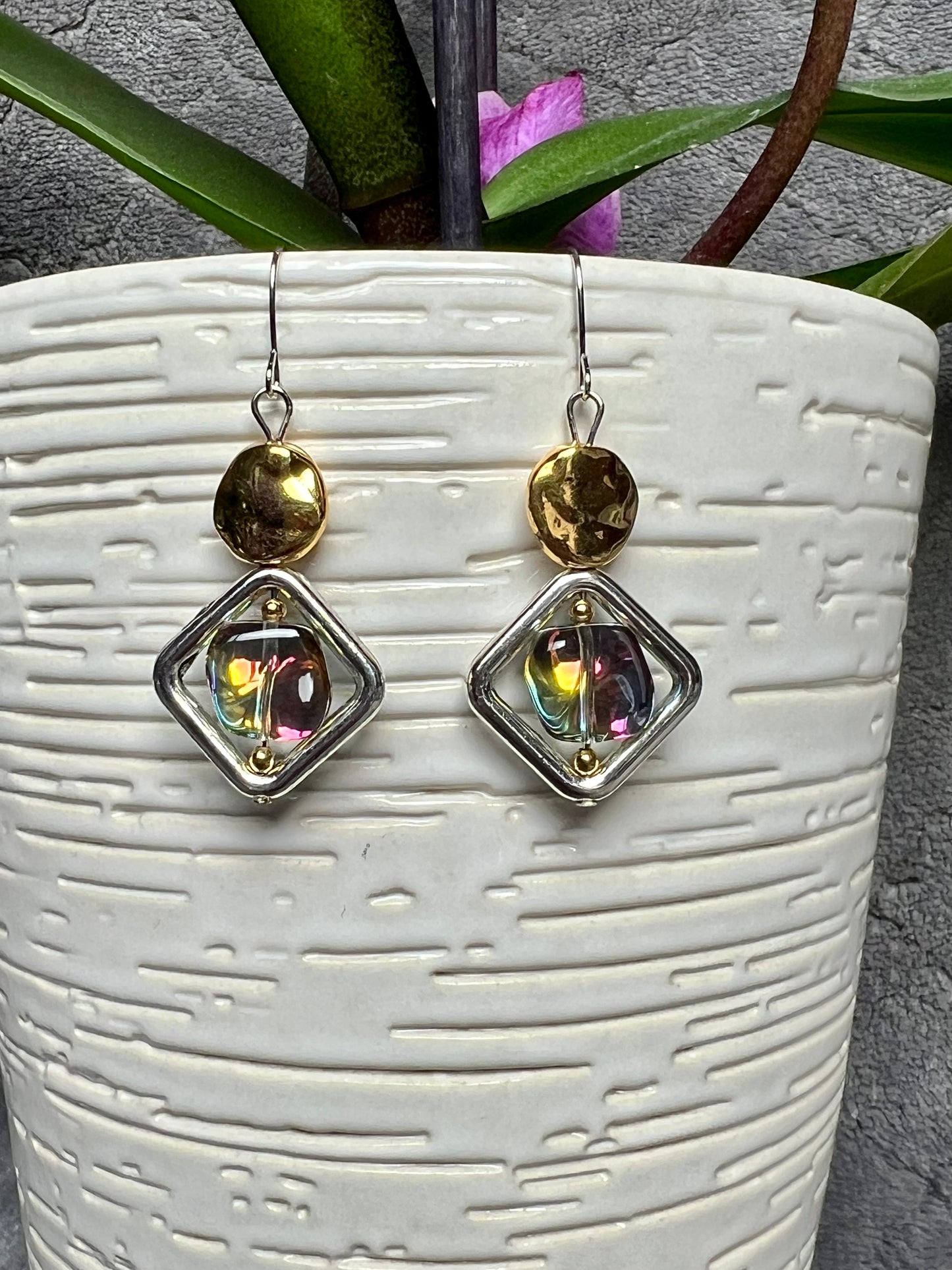 Earrings- Silver plated hooks, diamond shaped window bead, and rainbow coated pressed glass.