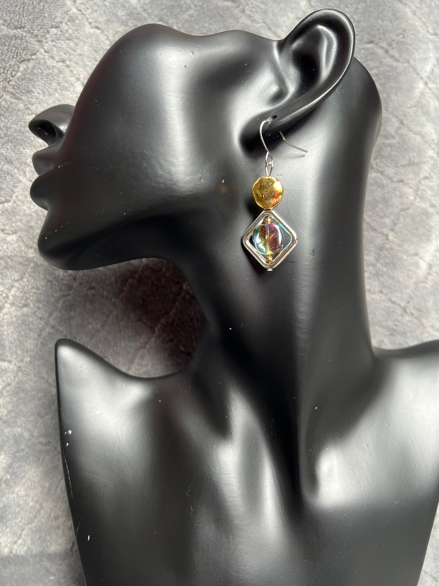 Earrings- Silver plated hooks, diamond shaped window bead, and rainbow coated pressed glass.