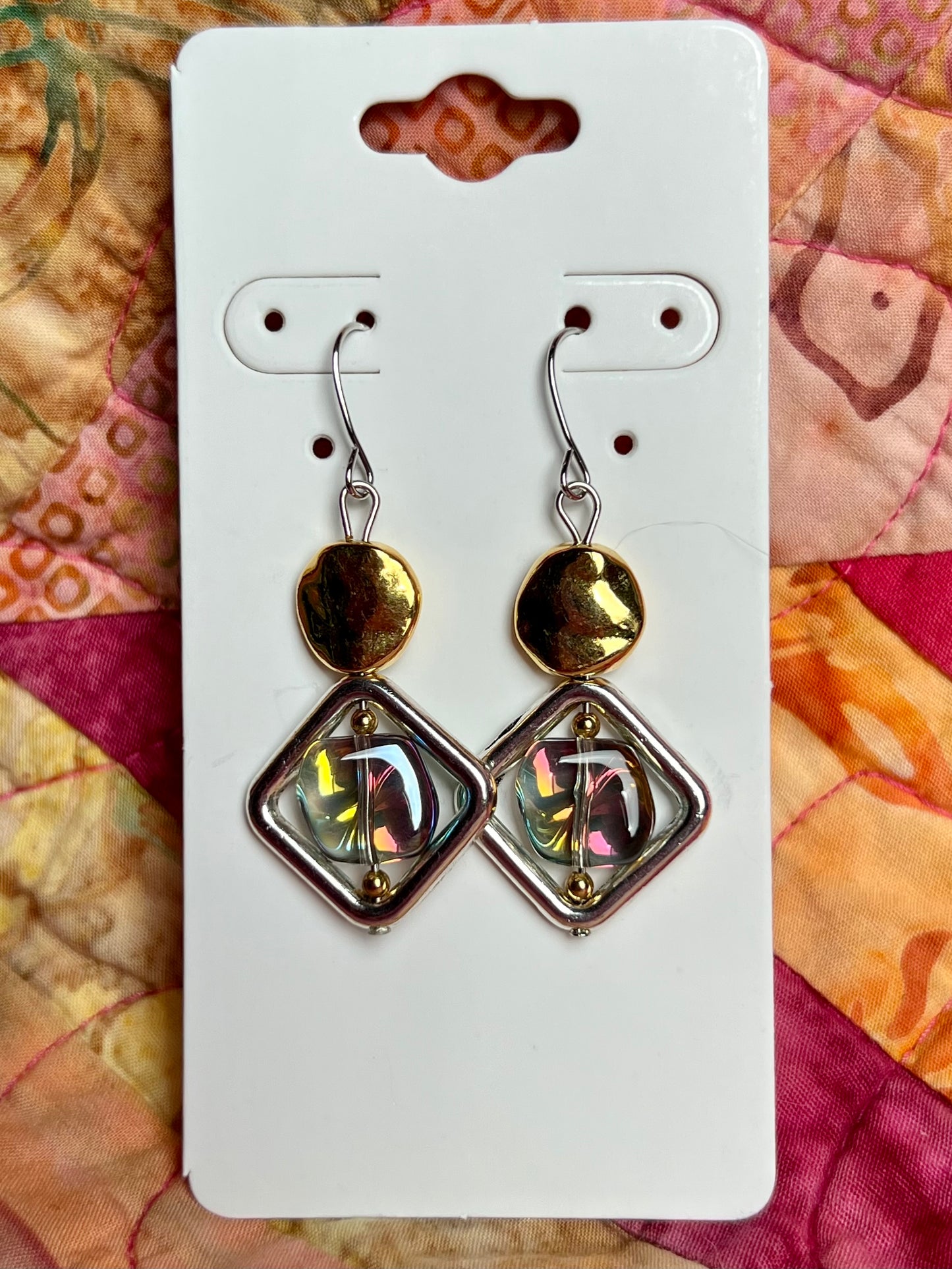 Earrings- Silver plated hooks, diamond shaped window bead, and rainbow coated pressed glass.