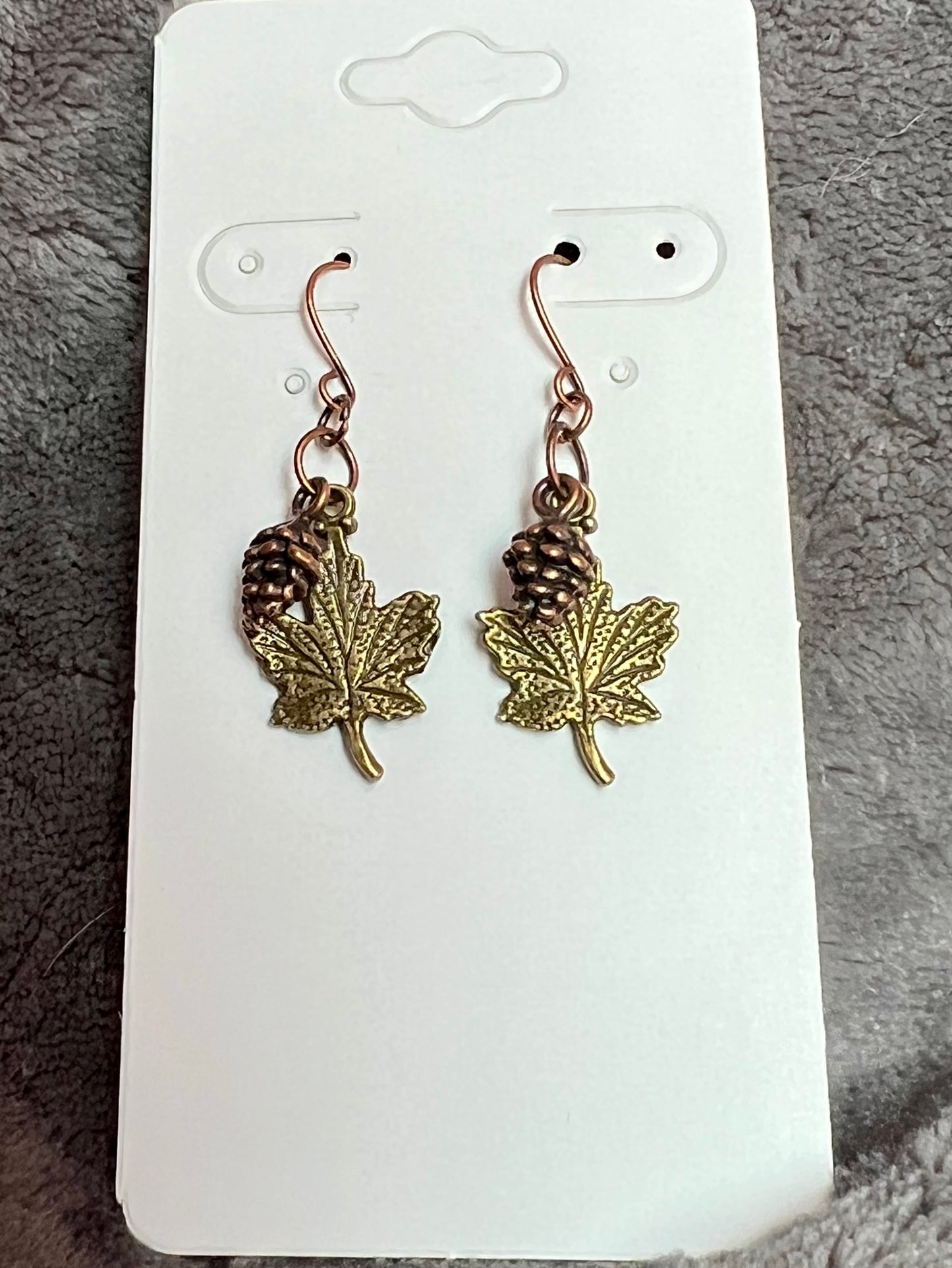 Earrings- Antique copper plated pine cone charms and antique gold plated maple leaf charms.