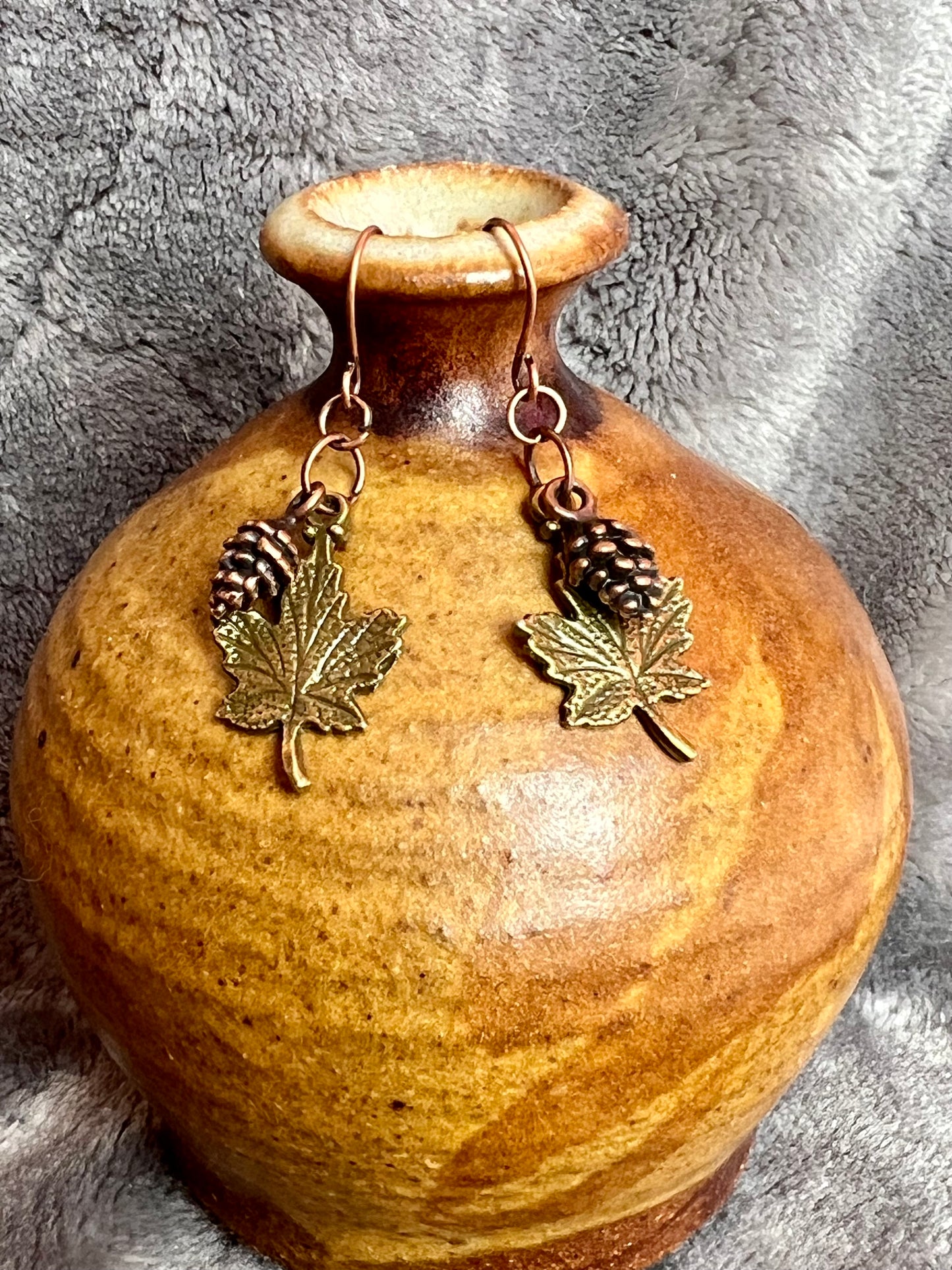 Earrings- Antique copper plated pine cone charms and antique gold plated maple leaf charms.