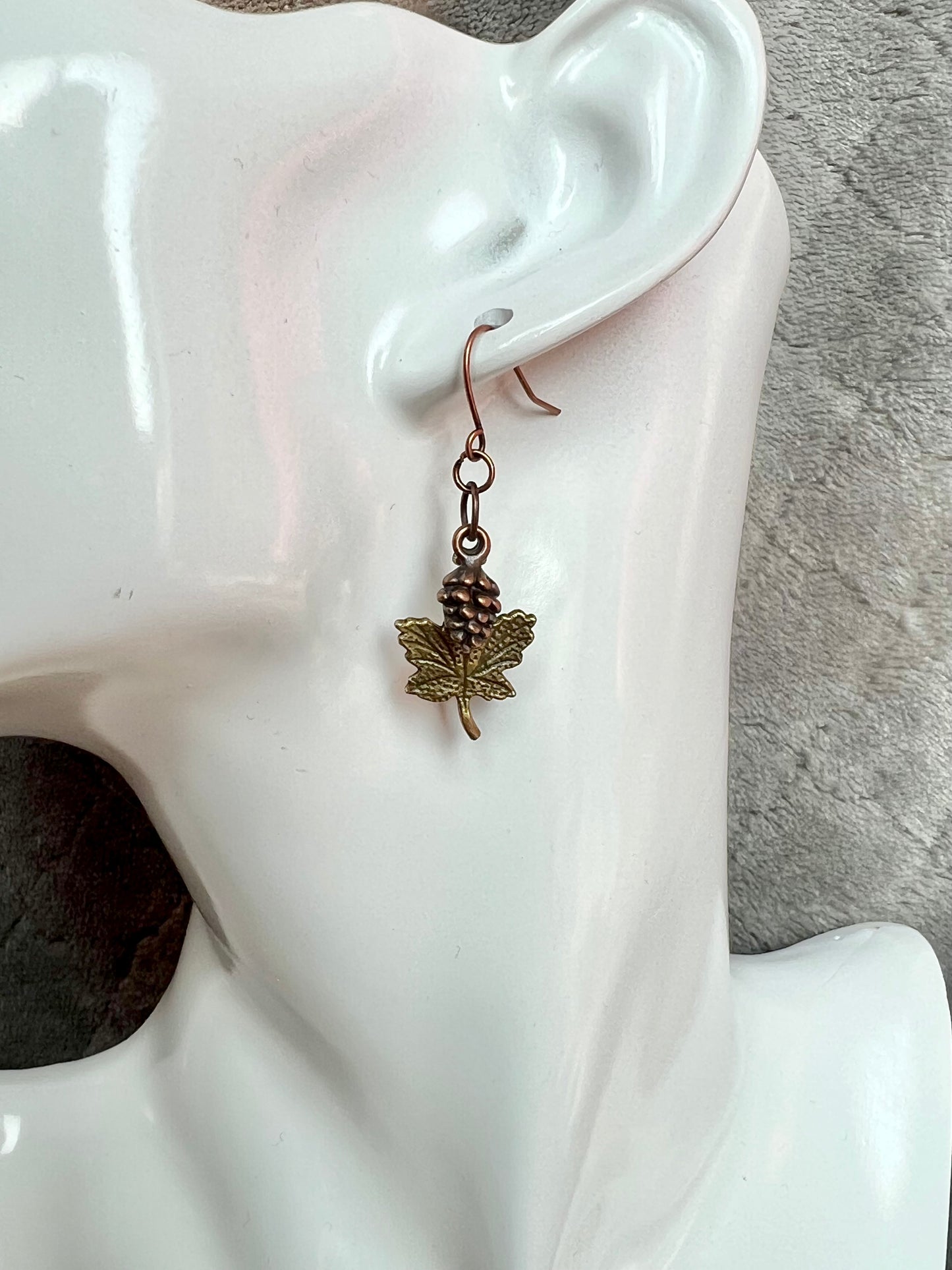 Earrings- Antique copper plated pine cone charms and antique gold plated maple leaf charms.