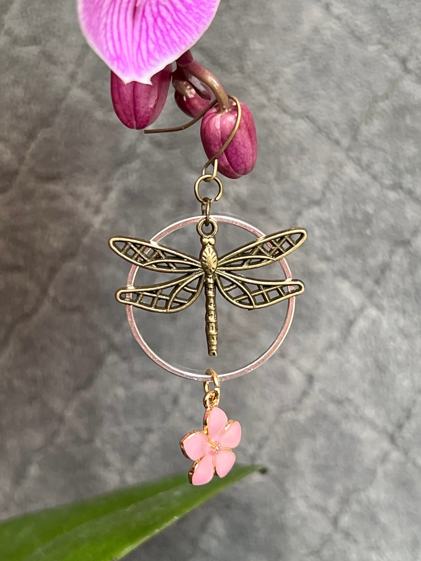 Earrings- Dragonfly earrings asymmetrical in color. Antique gold and silver dragon flies and hoops with pink flower charm.