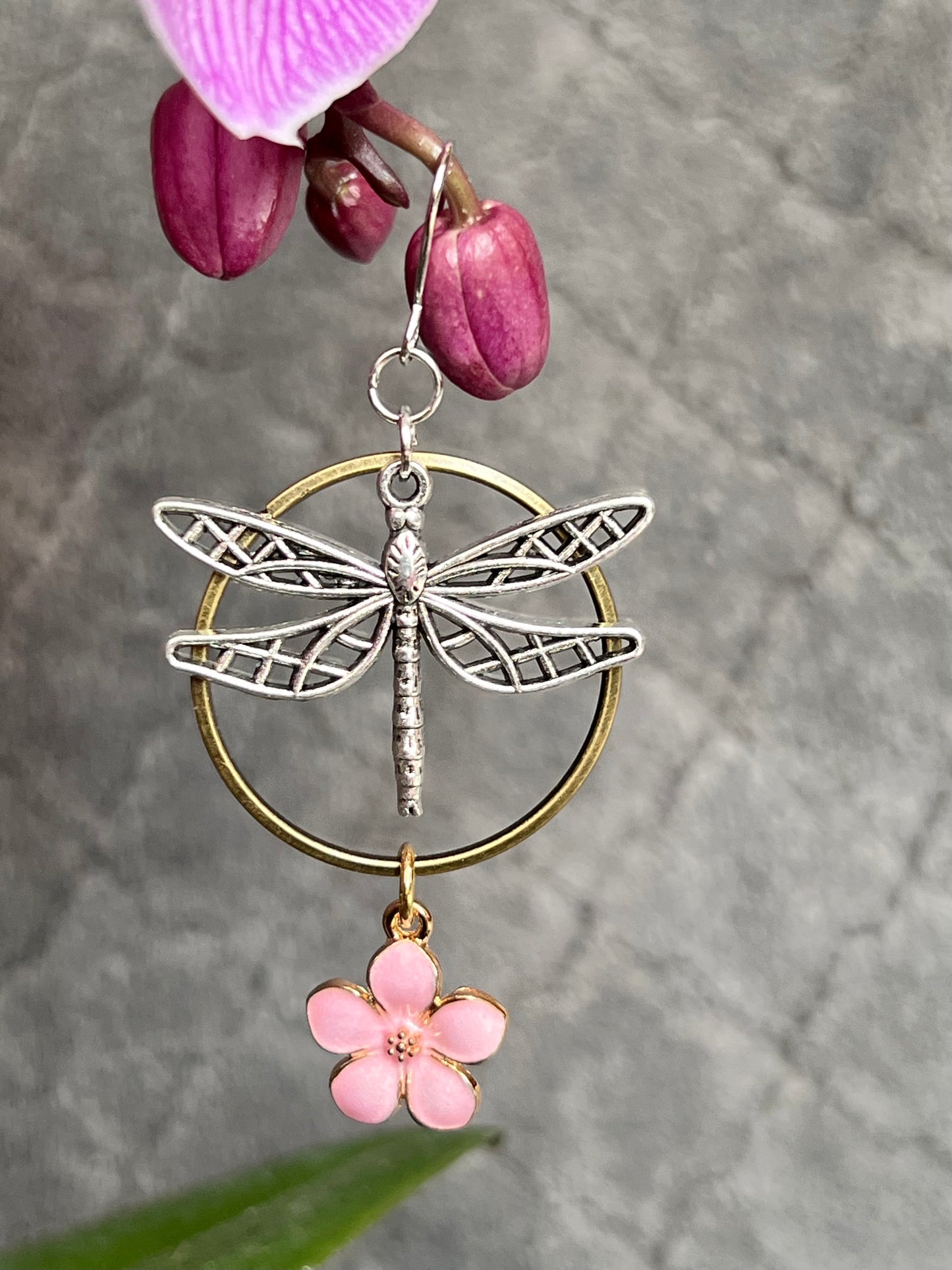 Earrings- Dragonfly earrings asymmetrical in color. Antique gold and silver dragon flies and hoops with pink flower charm.