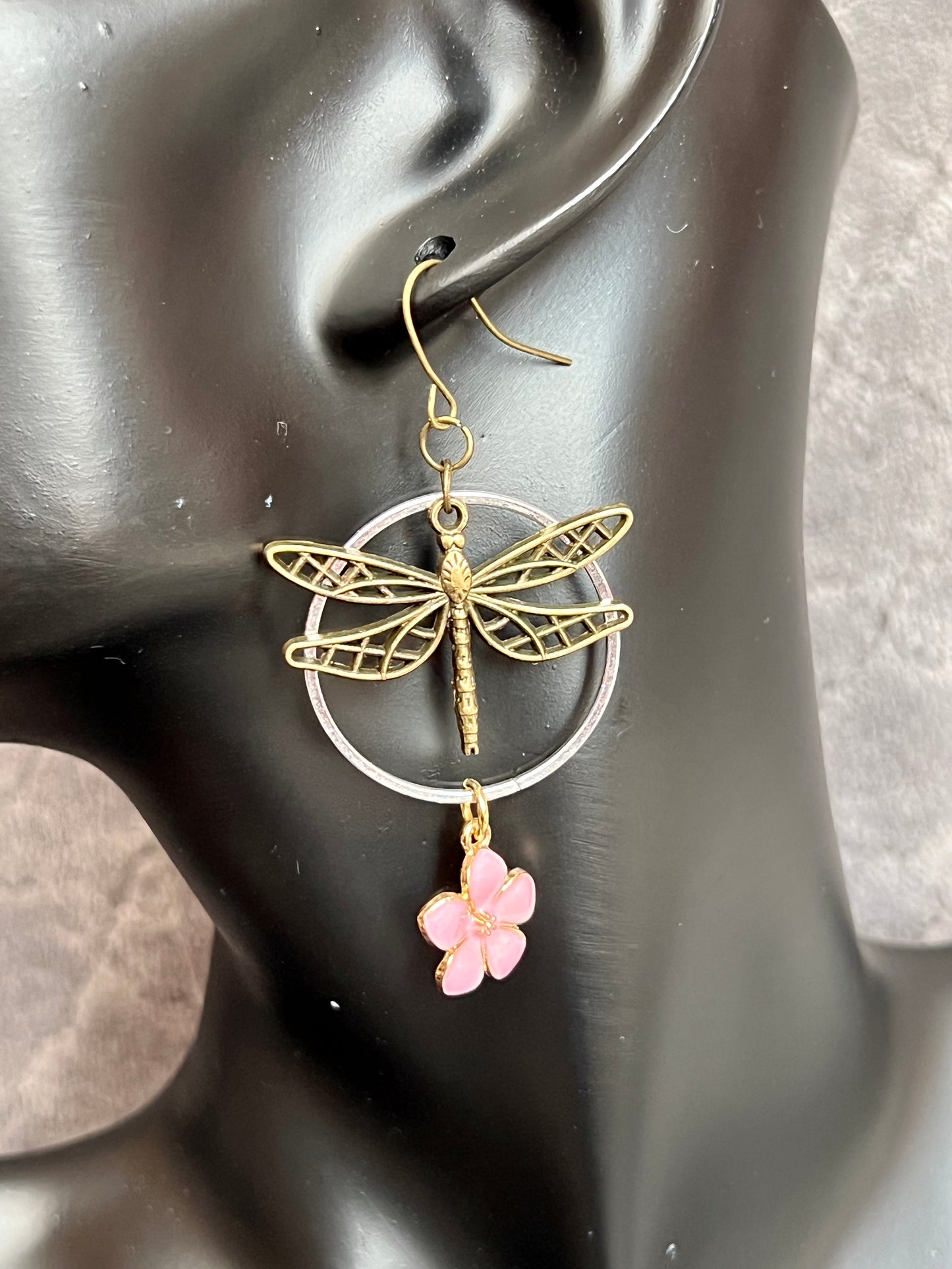 Earrings- Dragonfly earrings asymmetrical in color. Antique gold and silver dragon flies and hoops with pink flower charm.