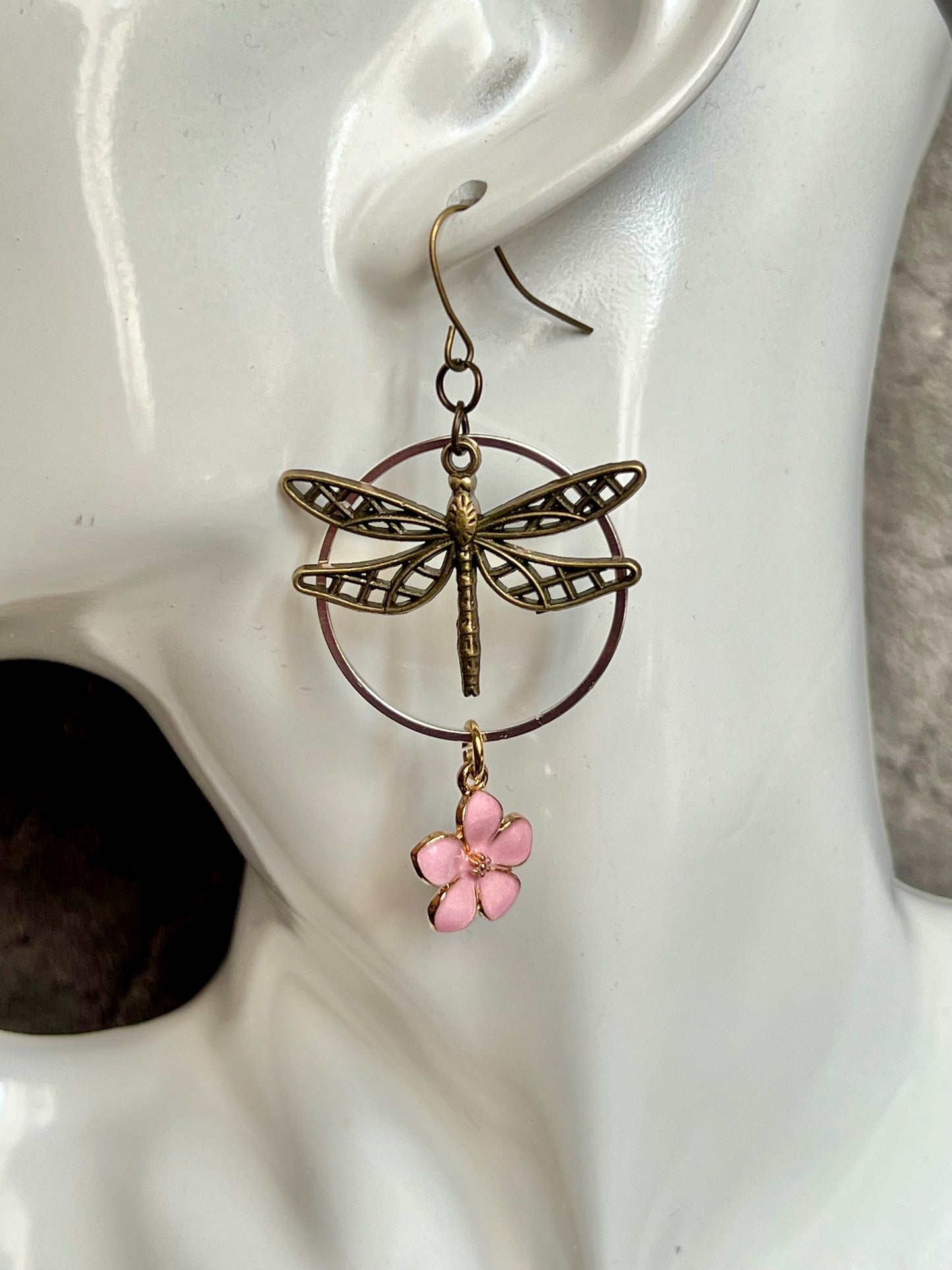 Earrings- Dragonfly earrings asymmetrical in color. Antique gold and silver dragon flies and hoops with pink flower charm.