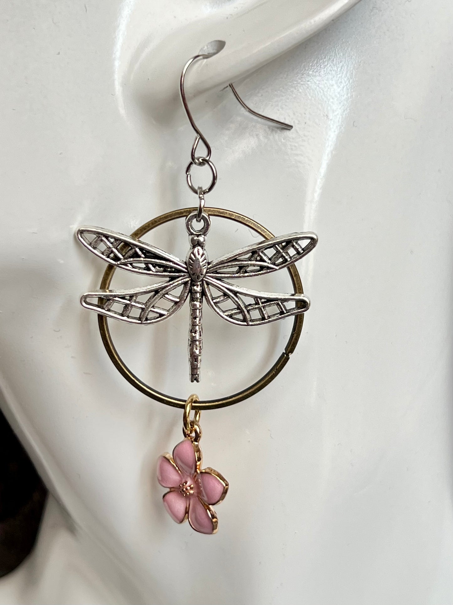 Earrings- Dragonfly earrings asymmetrical in color. Antique gold and silver dragon flies and hoops with pink flower charm.