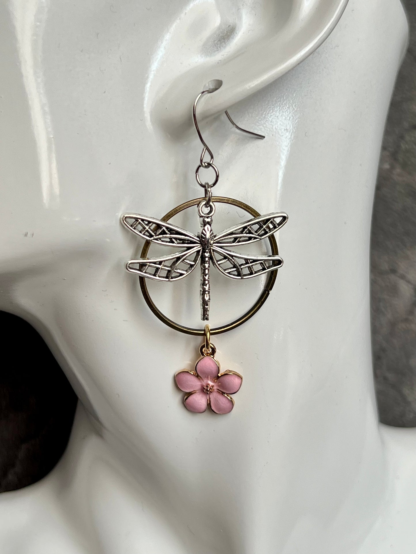 Earrings- Dragonfly earrings asymmetrical in color. Antique gold and silver dragon flies and hoops with pink flower charm.